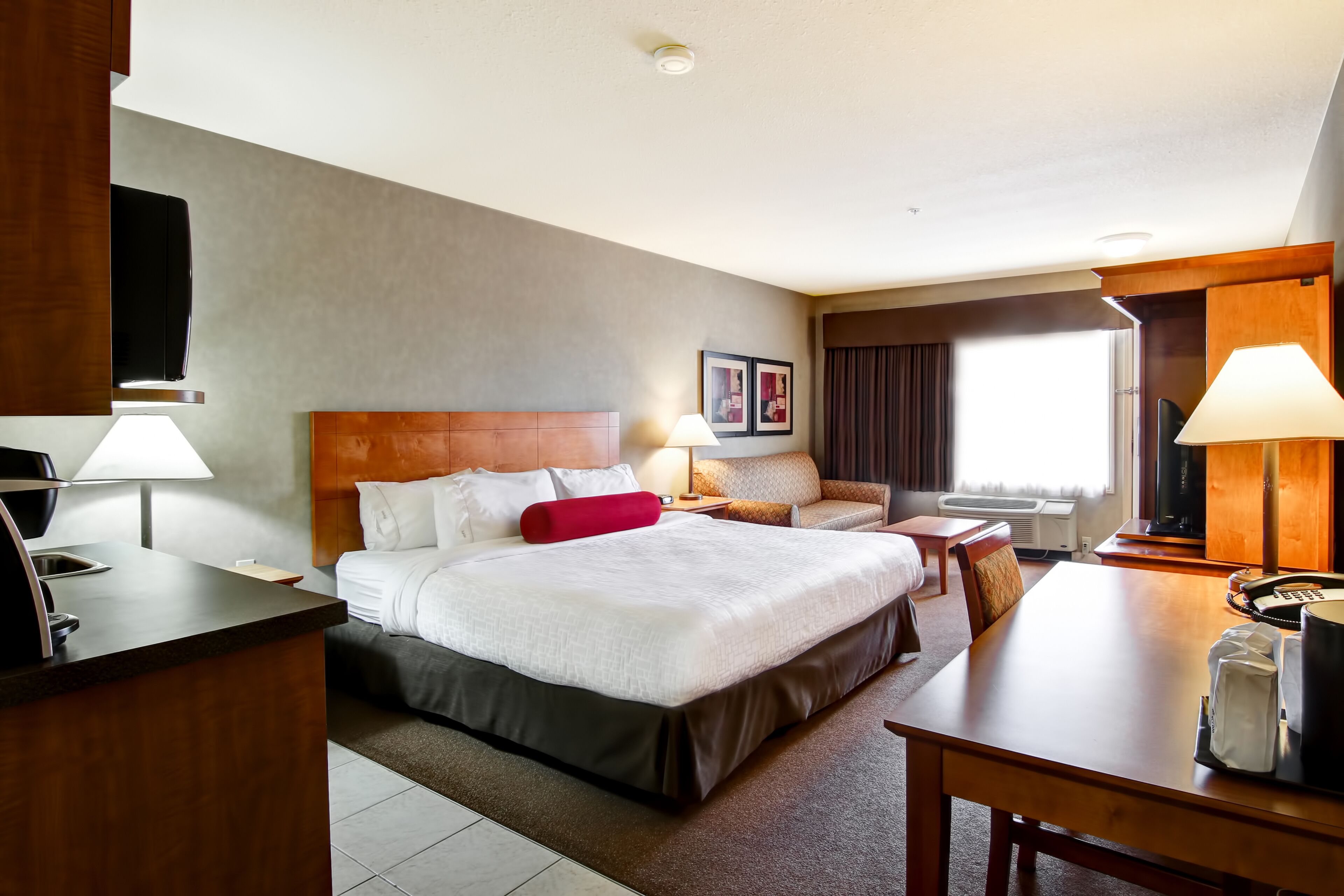 Guest room at the Ramada by Wyndham Ponoka in Ponoka, Alberta