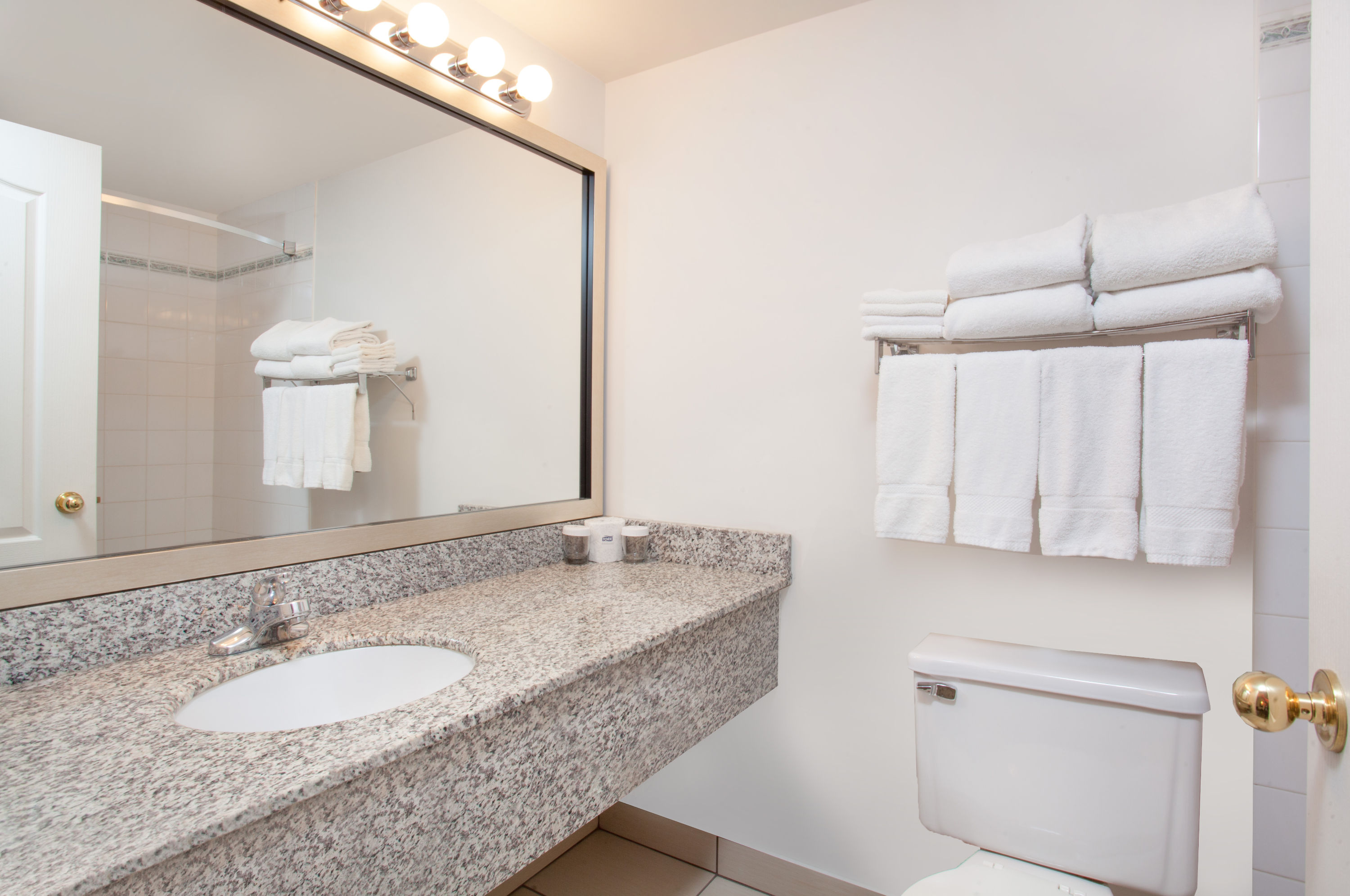 Guest room bath at the Ramada by Wyndham Red Deer Hotel & Suites in Red Deer, Alberta