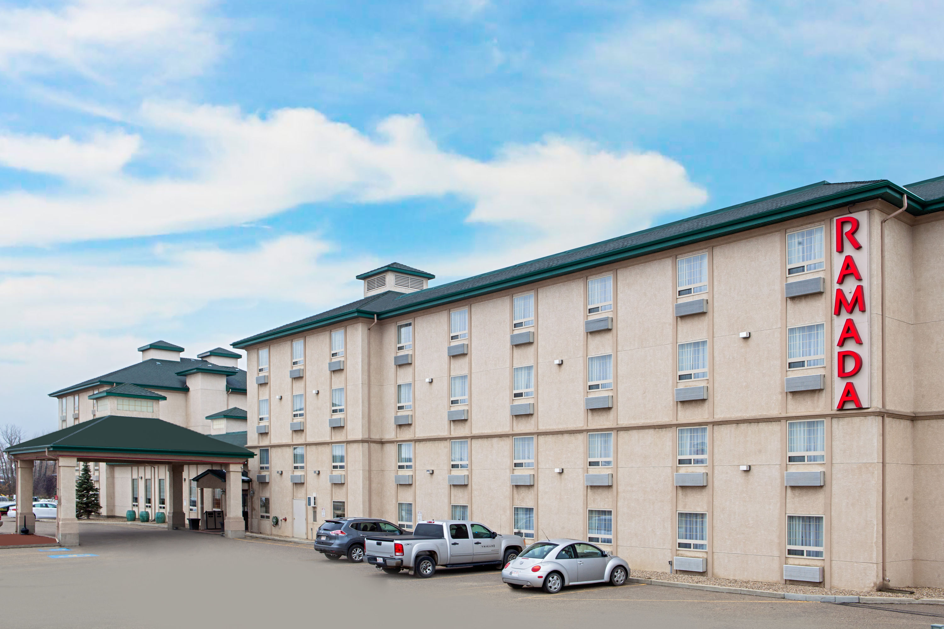 Exterior Day Image of Ramada by Wyndham Red Deer Hotel & Suites hotel in Red Deer, Alberta