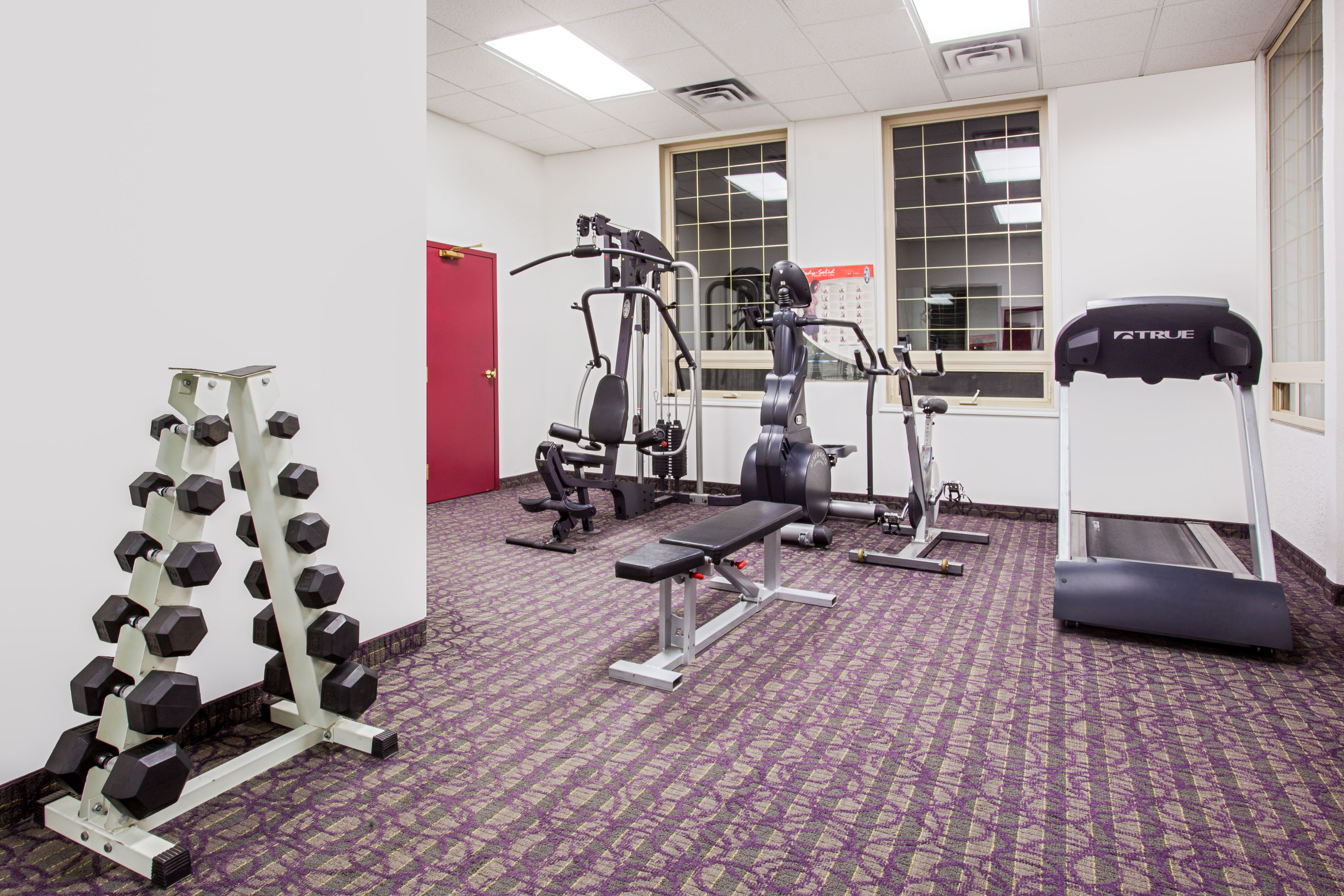 Fitness room at Ramada by Wyndham Red Deer Hotel & Suites in Red Deer, Alberta