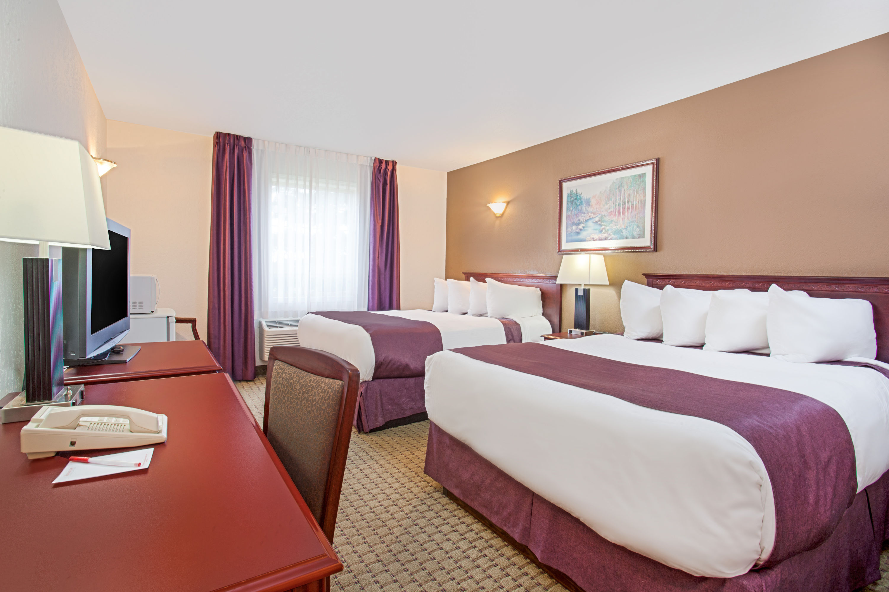 Guest room at the Ramada by Wyndham Red Deer Hotel & Suites in Red Deer, Alberta