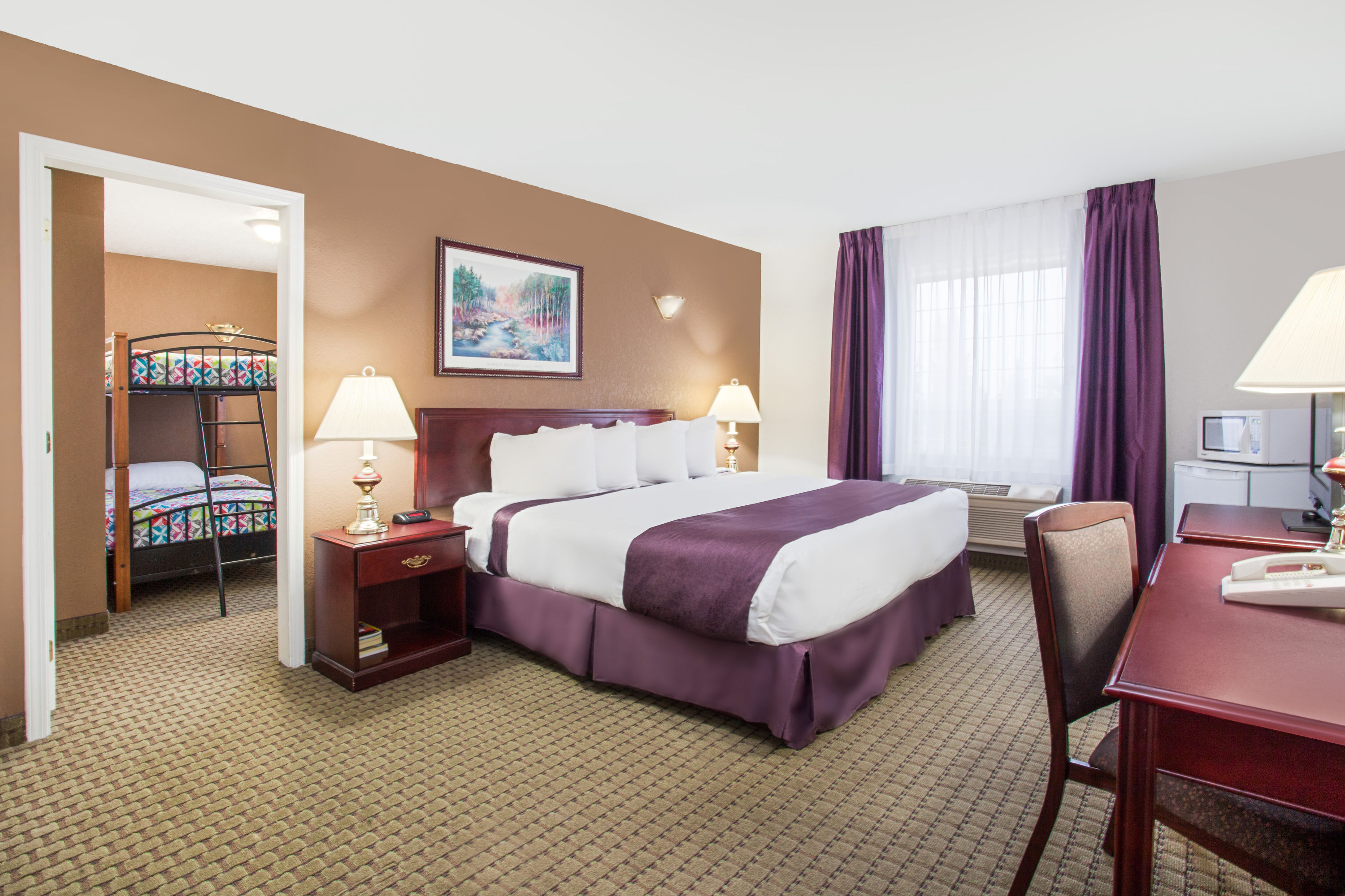 Guest room at the Ramada by Wyndham Red Deer Hotel & Suites in Red Deer, Alberta