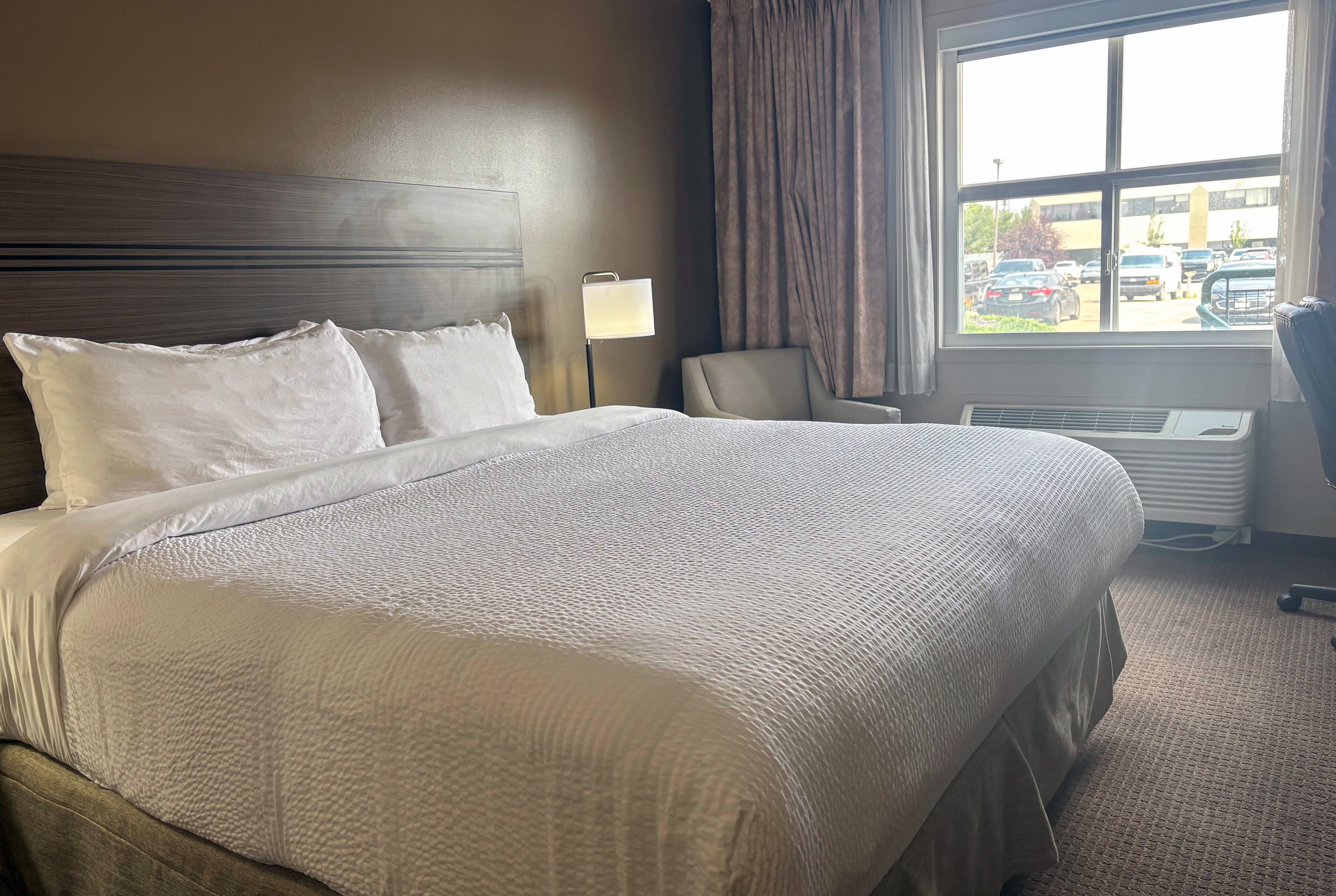 Guest room at the Ramada by Wyndham Sherwood Park in Sherwood Park, Alberta