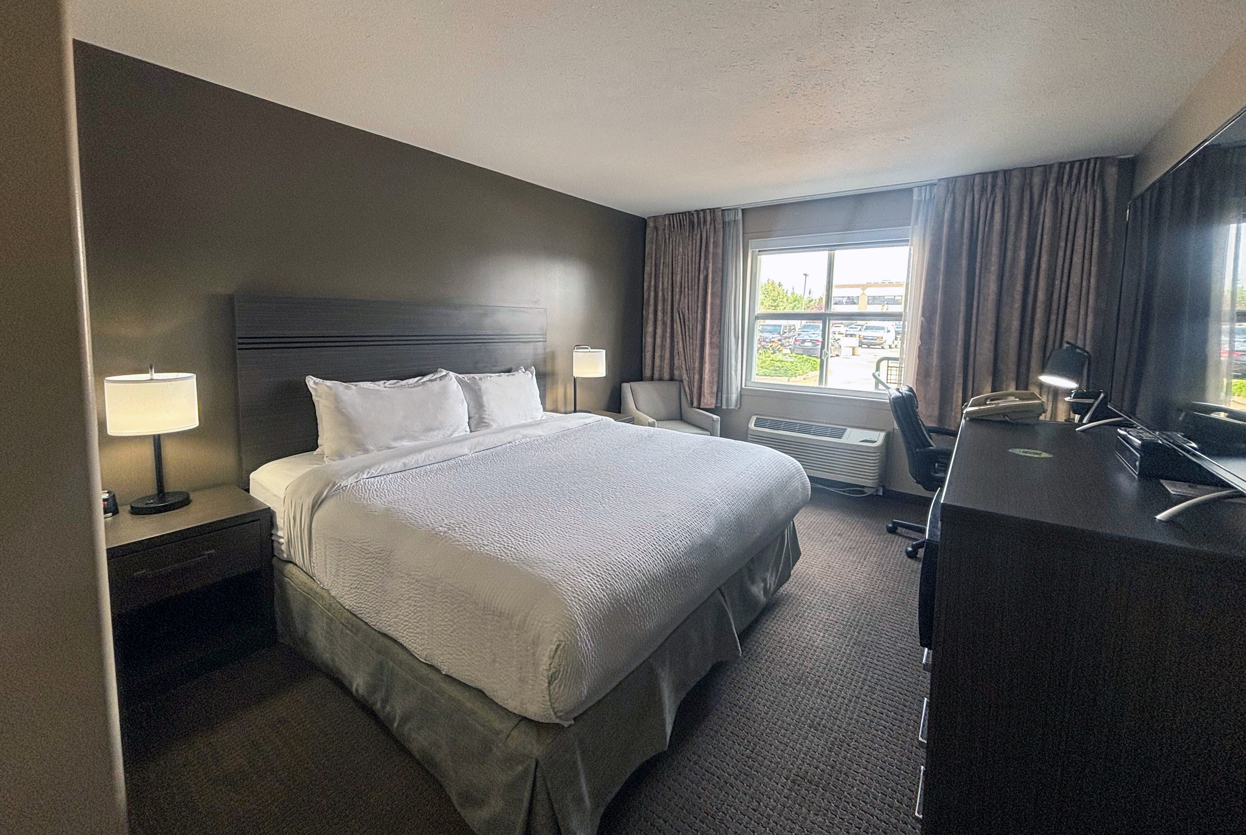 Guest room at the Ramada by Wyndham Sherwood Park in Sherwood Park, Alberta