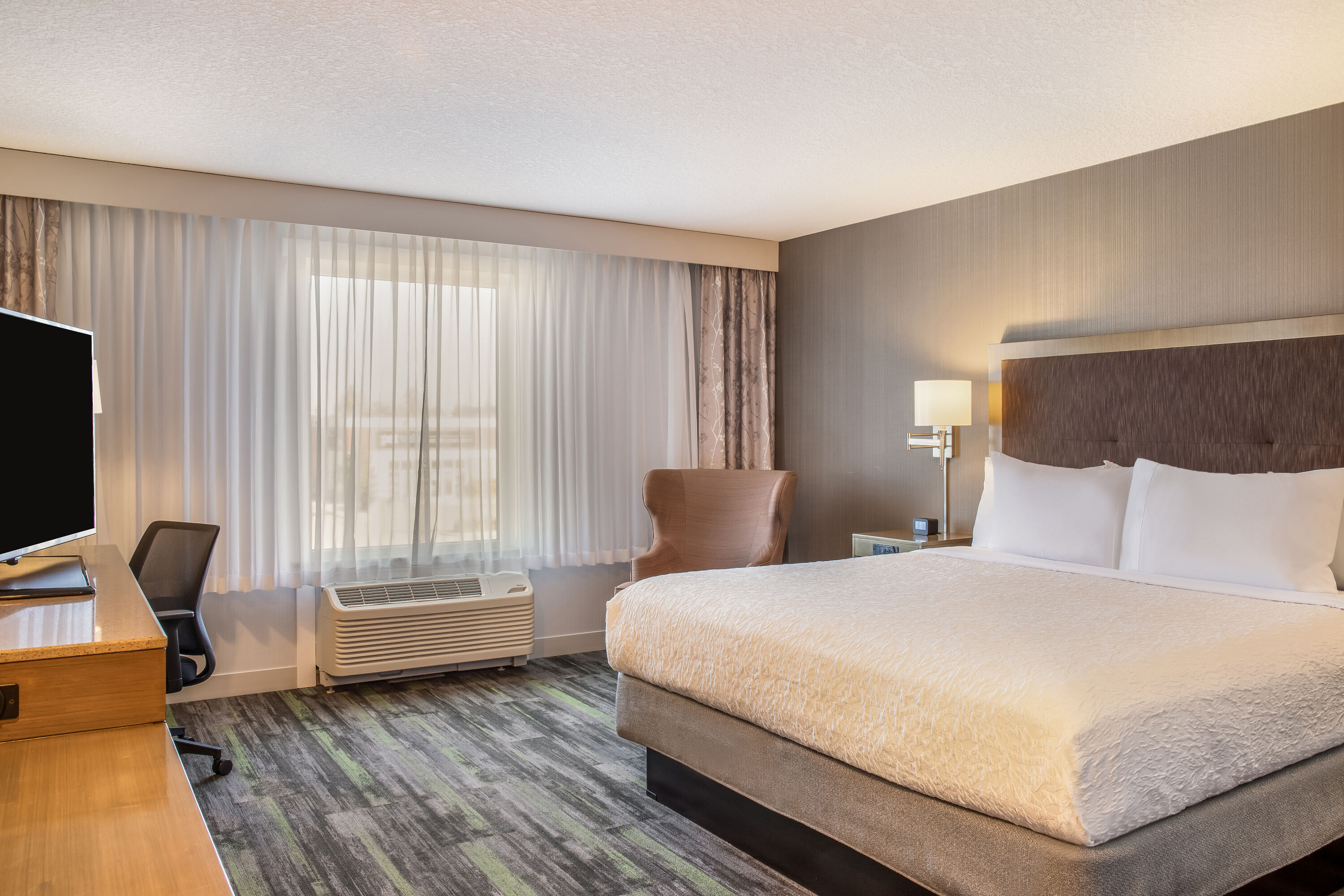 King bed guest room at the Ramada by Wyndham St. Paul AB in St Paul, Alberta