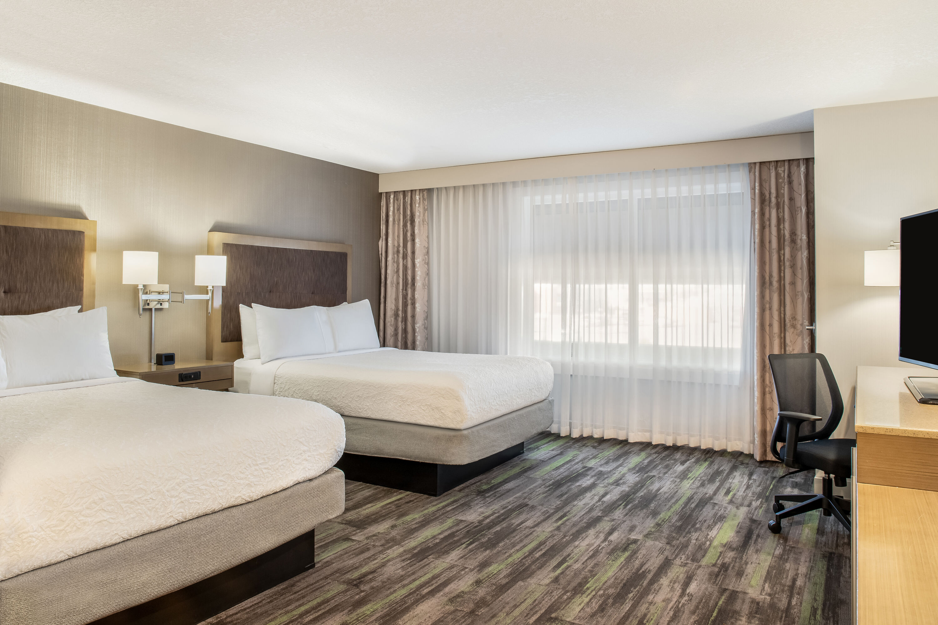 Queen bed guest room at the Ramada by Wyndham St. Paul AB in St Paul, Alberta