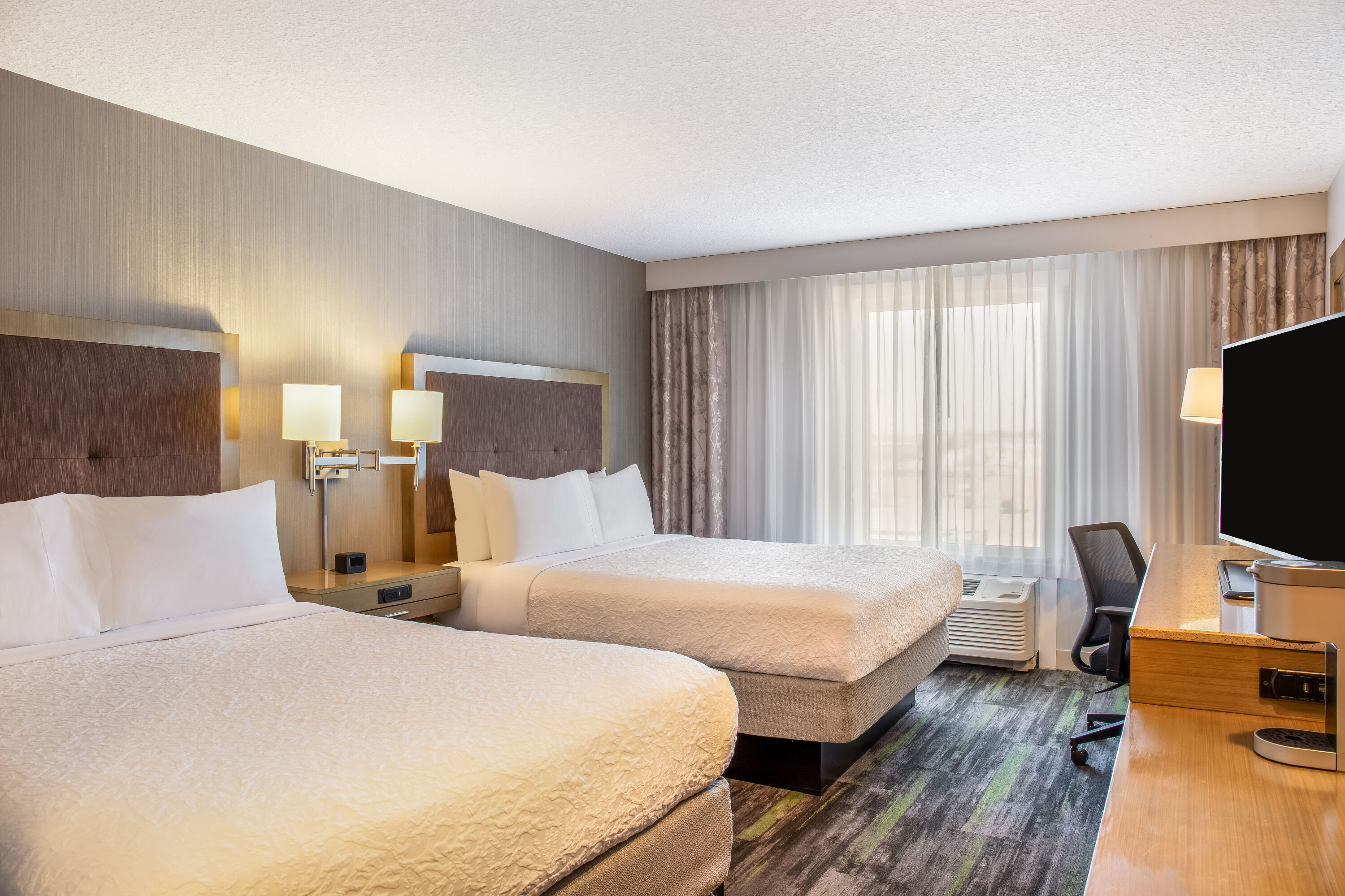 Queen bed guest room at the Ramada by Wyndham St. Paul AB in St Paul, Alberta