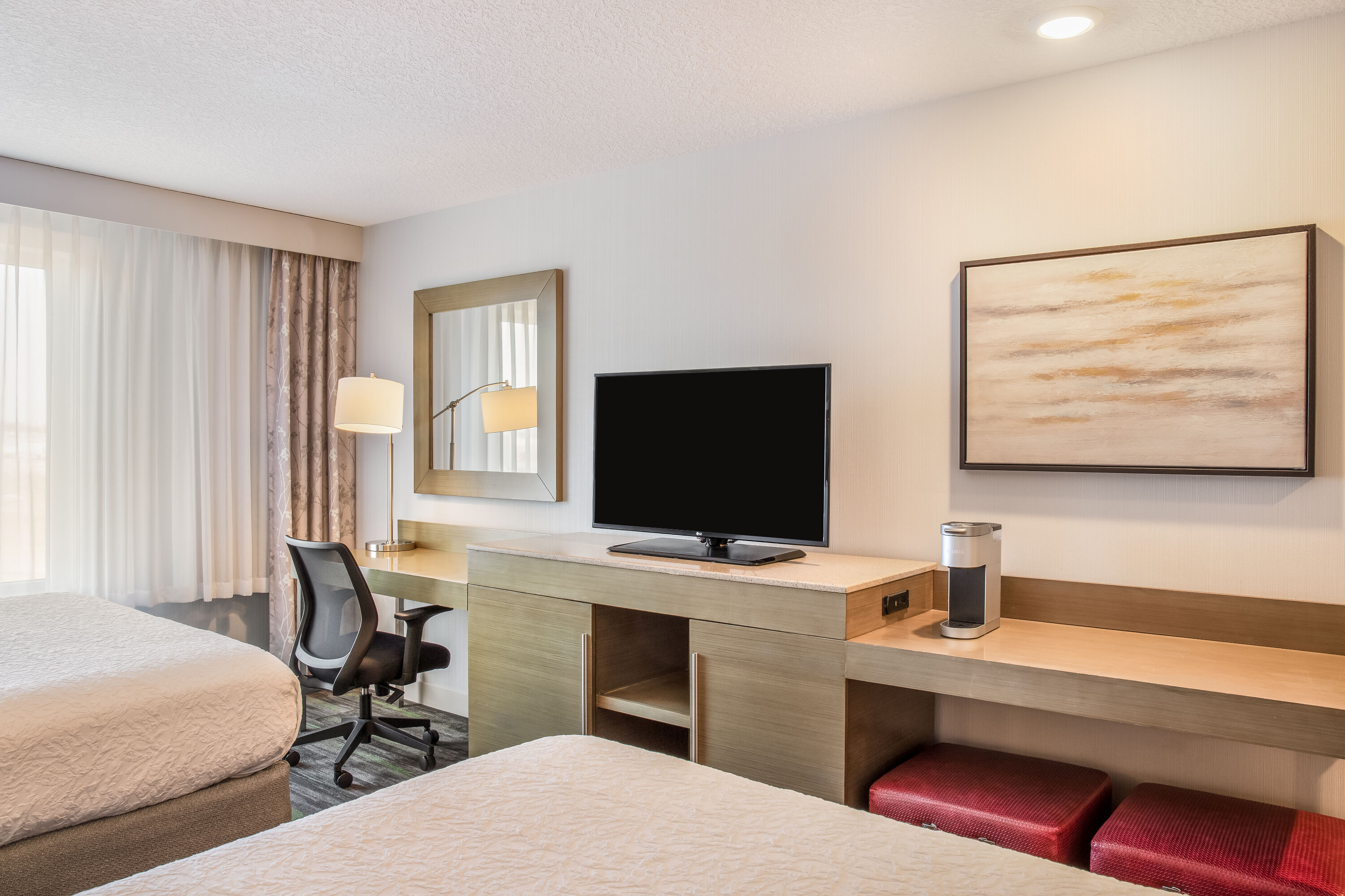 Queen bed guest room at the Ramada by Wyndham St. Paul AB in St Paul, Alberta