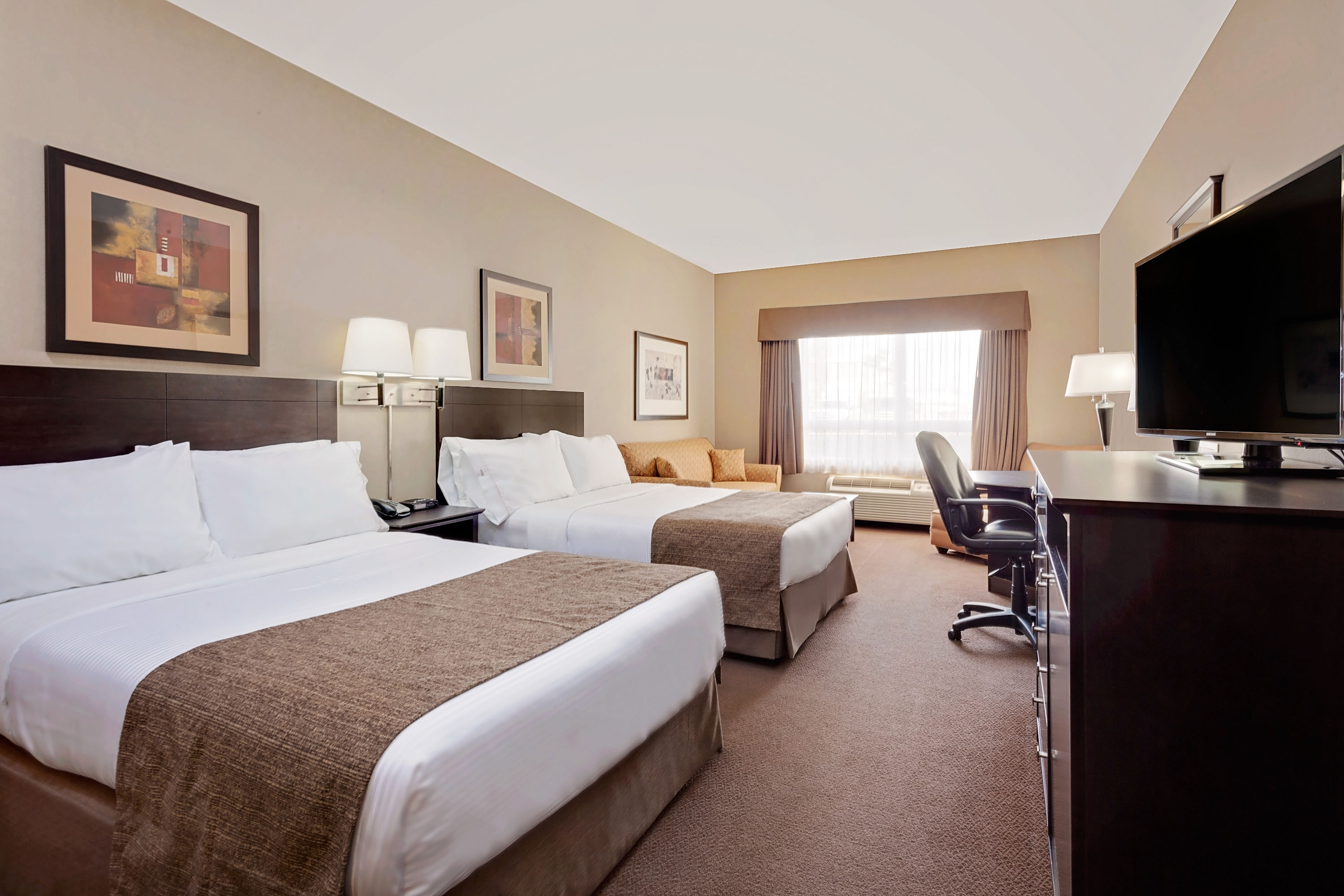 Guest room at the Ramada by Wyndham Stettler in Stettler, Alberta