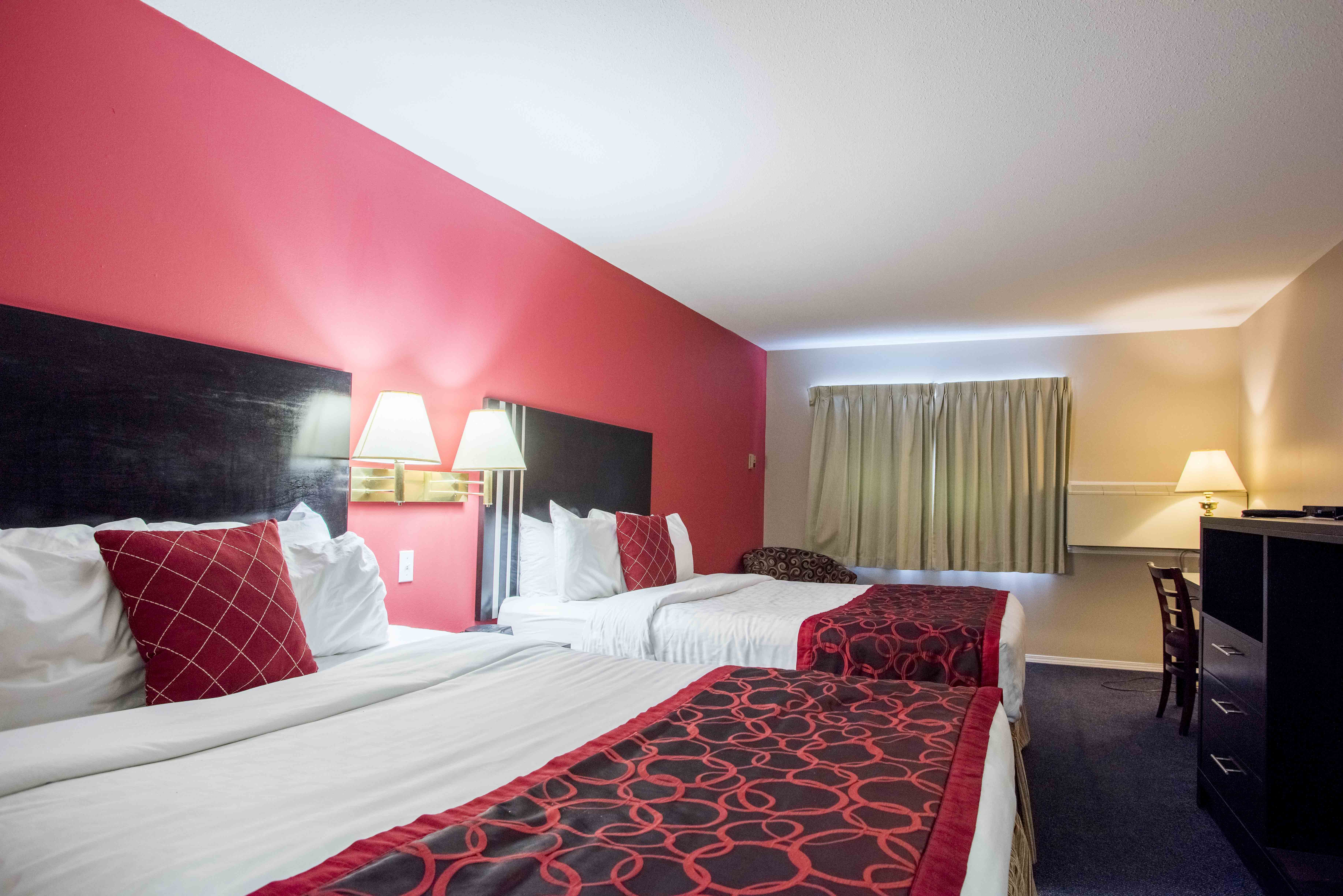 Guest room at the Ramada by Wyndham 100 Mile House in 100 Mile House, British Columbia