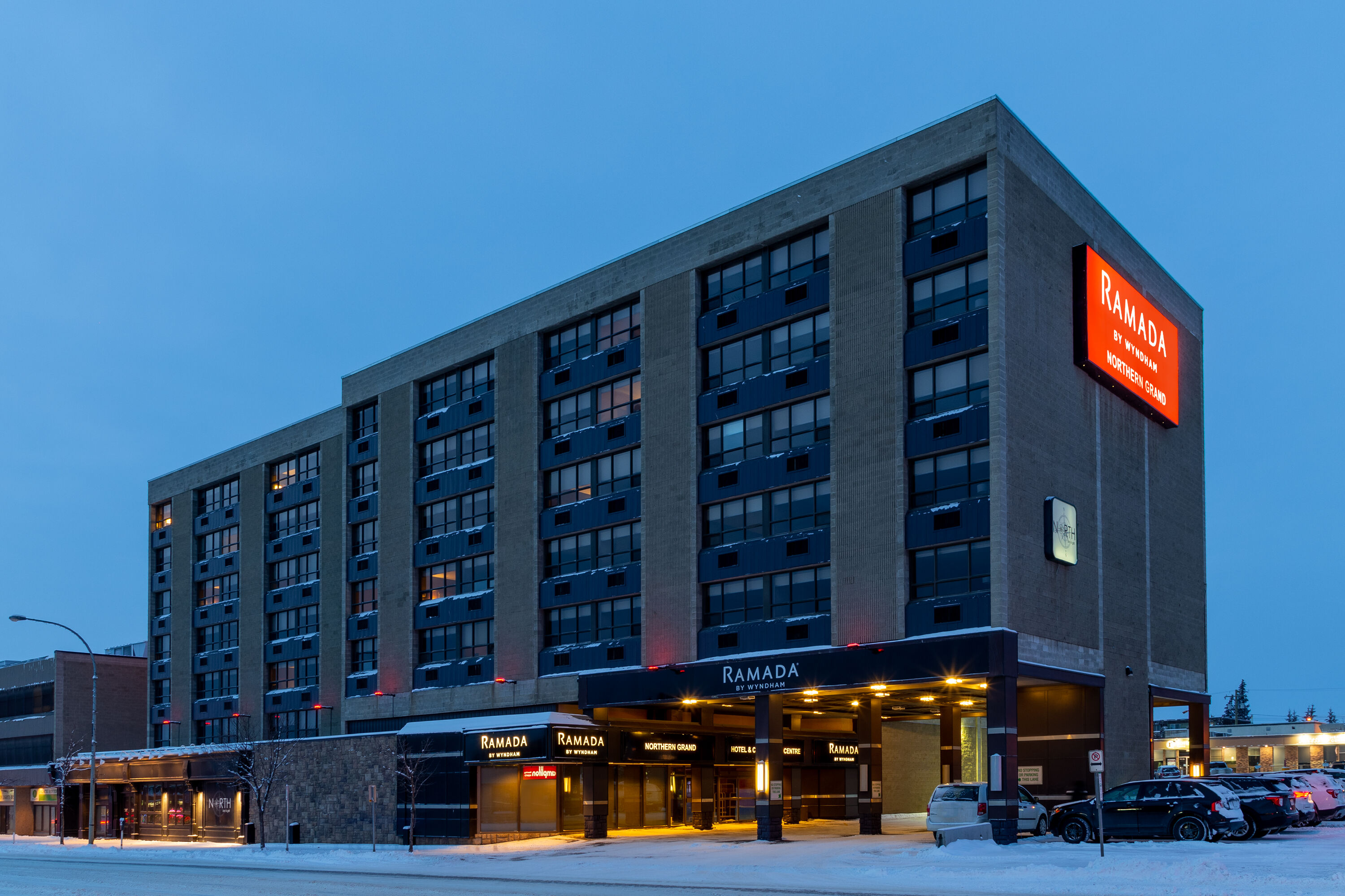 Exterior Dusk Image of Ramada by Wyndham Northern Grand Hotel & Conference Centre hotel in Fort St John, British Columbia