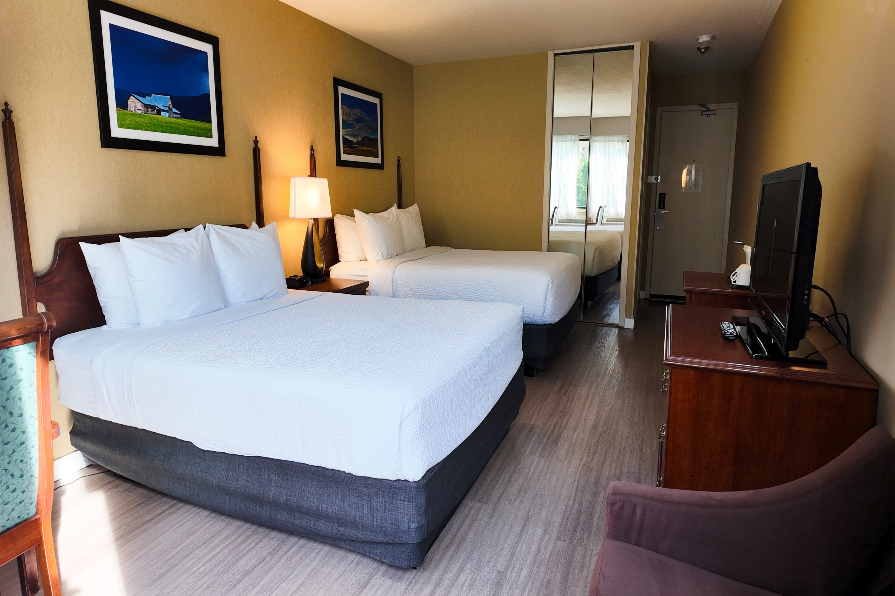 Guest room at the Ramada by Wyndham Kelowna Hotel & Conference Center in Kelowna, British Columbia