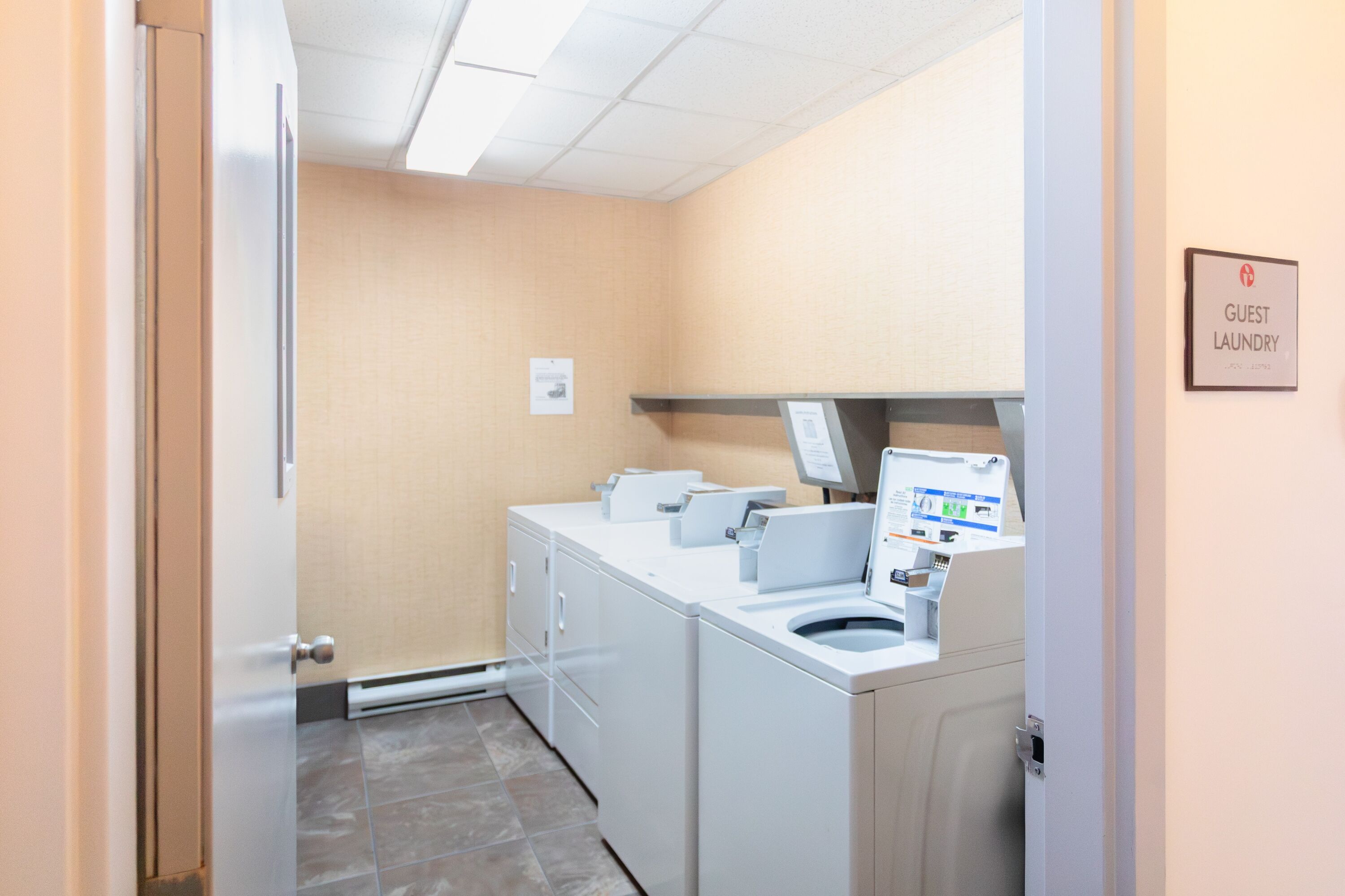 Laundry facilities at Ramada by Wyndham Surrey/Langley in Surrey, British Columbia