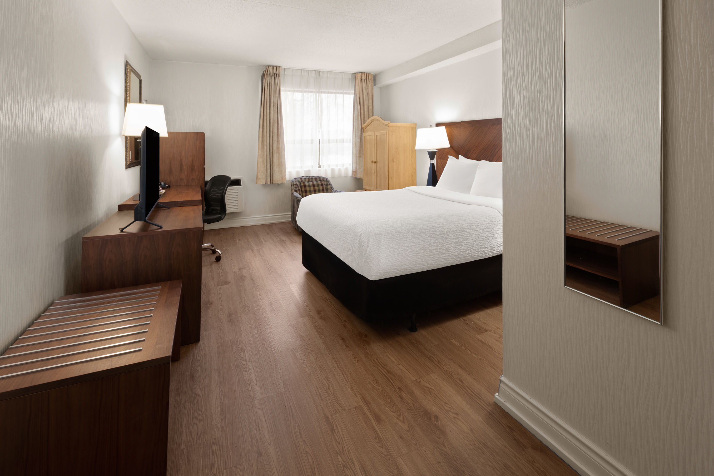 Guest room at the Ramada by Wyndham Arnprior in Arnprior, Ontario
