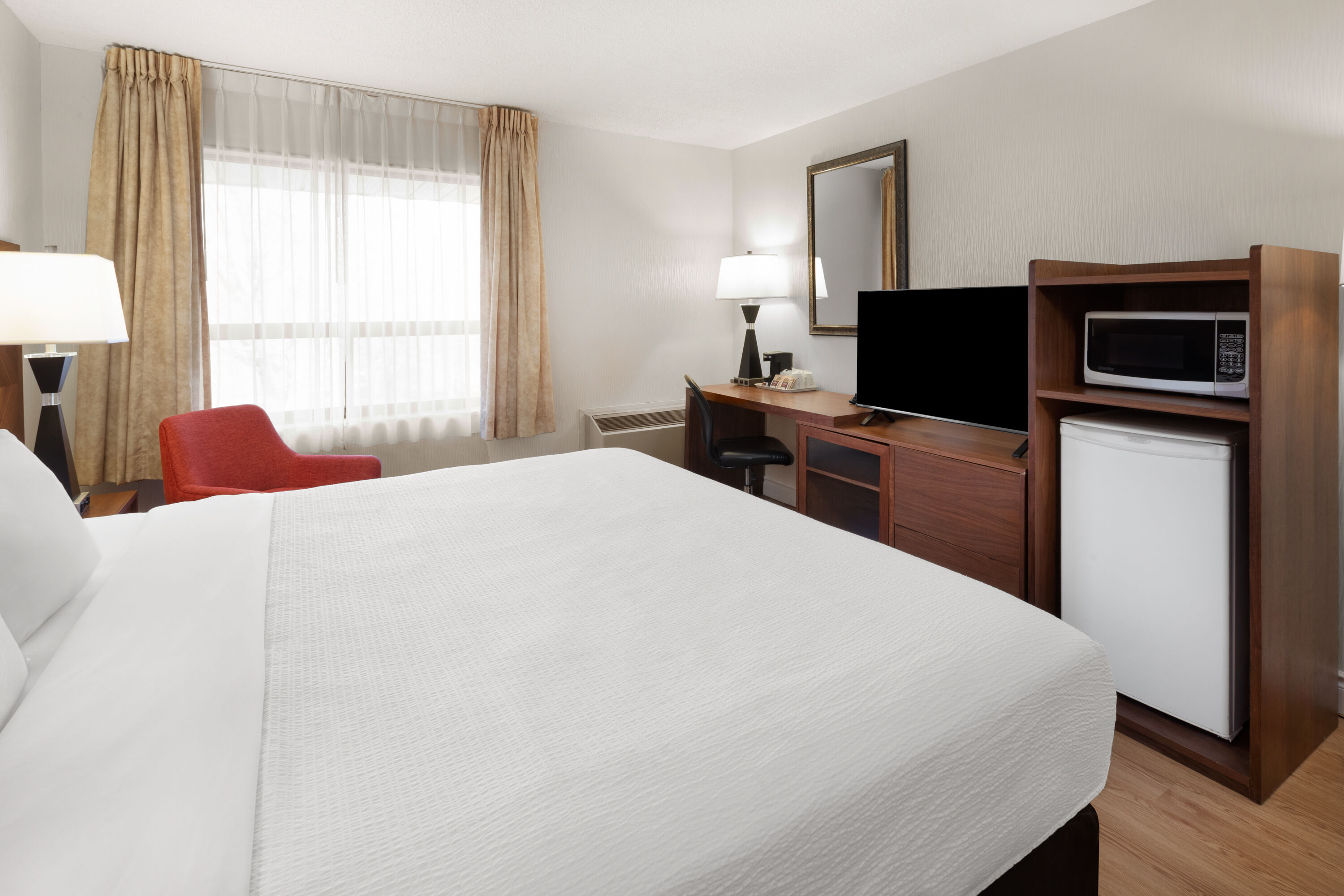 Guest room at the Ramada by Wyndham Arnprior in Arnprior, Ontario