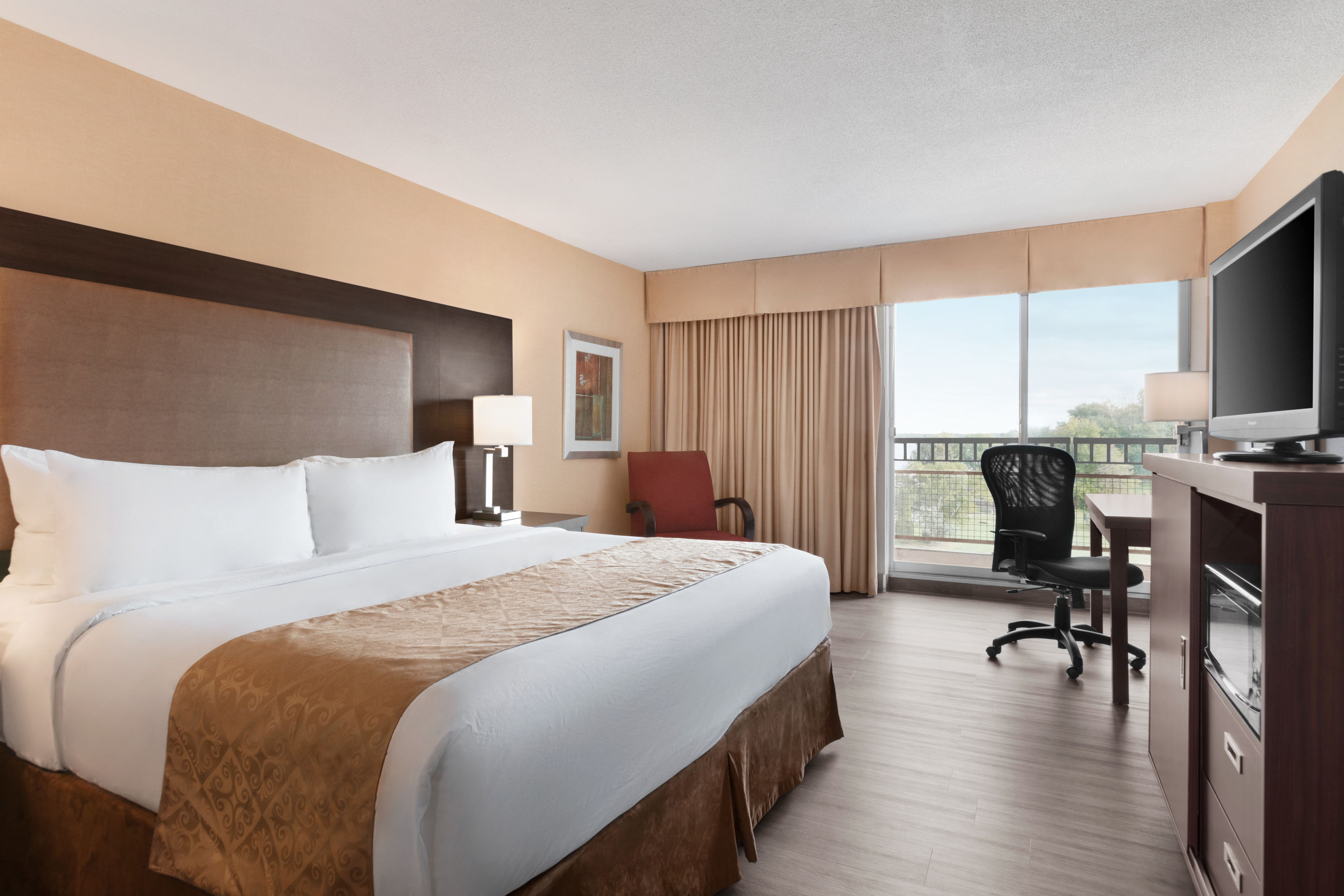 Guest room at the Ramada by Wyndham Belleville Harbourview Conference Centre in Belleville, Ontario