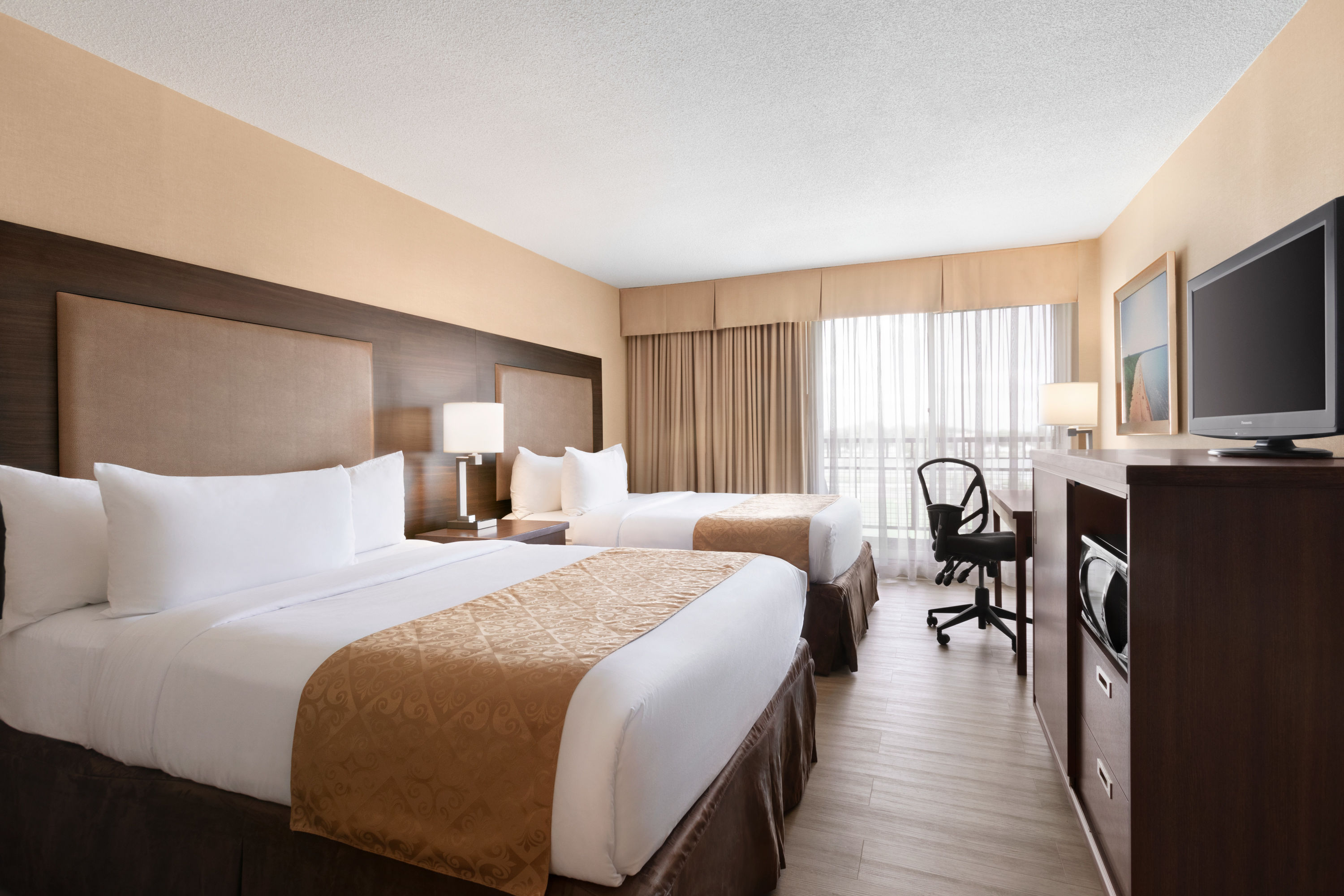 Guest room at the Ramada by Wyndham Belleville Harbourview Conference Centre in Belleville, Ontario