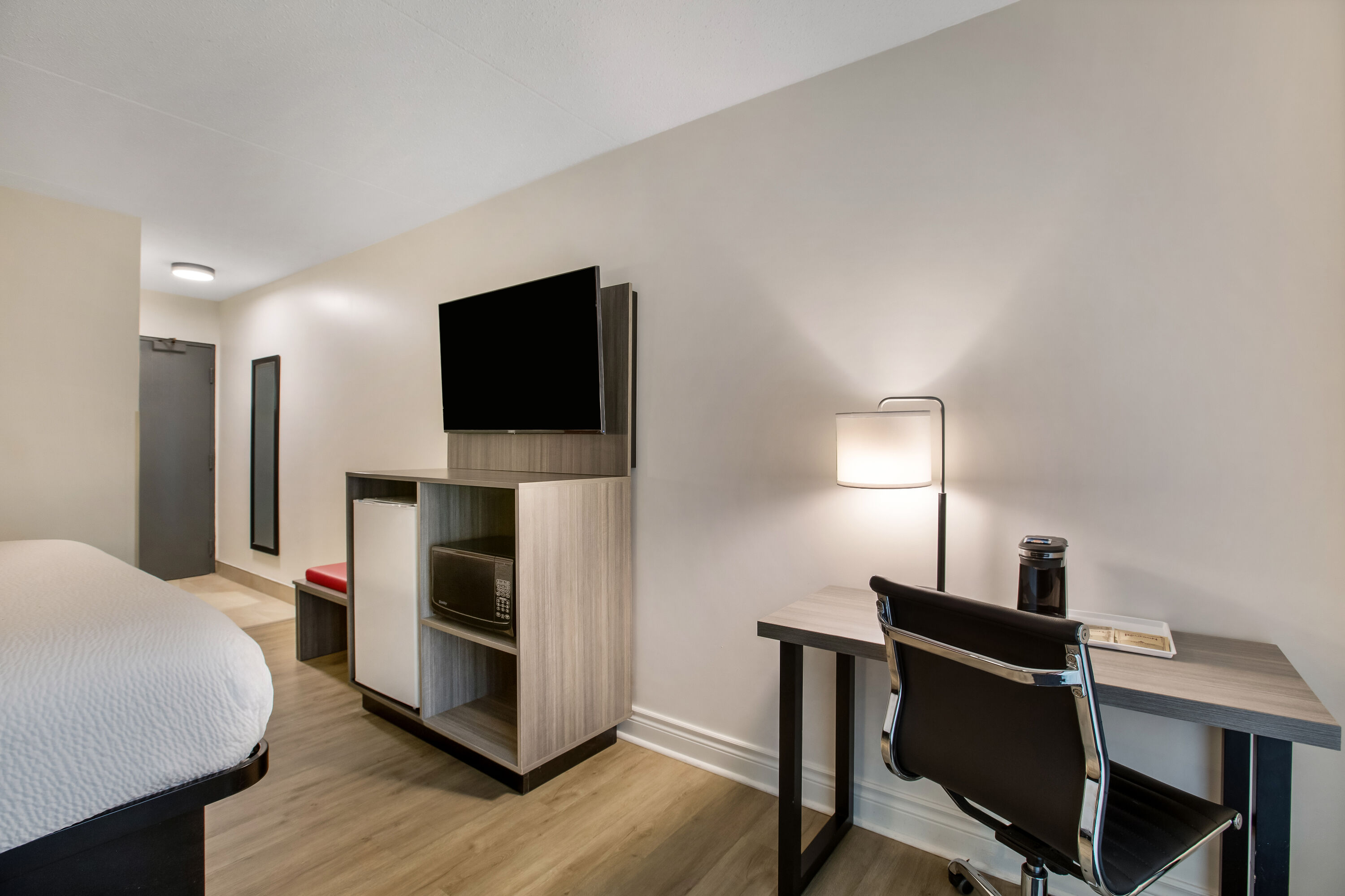 King bed guest room at the Ramada by Wyndham Kingston in Kingston, Ontario