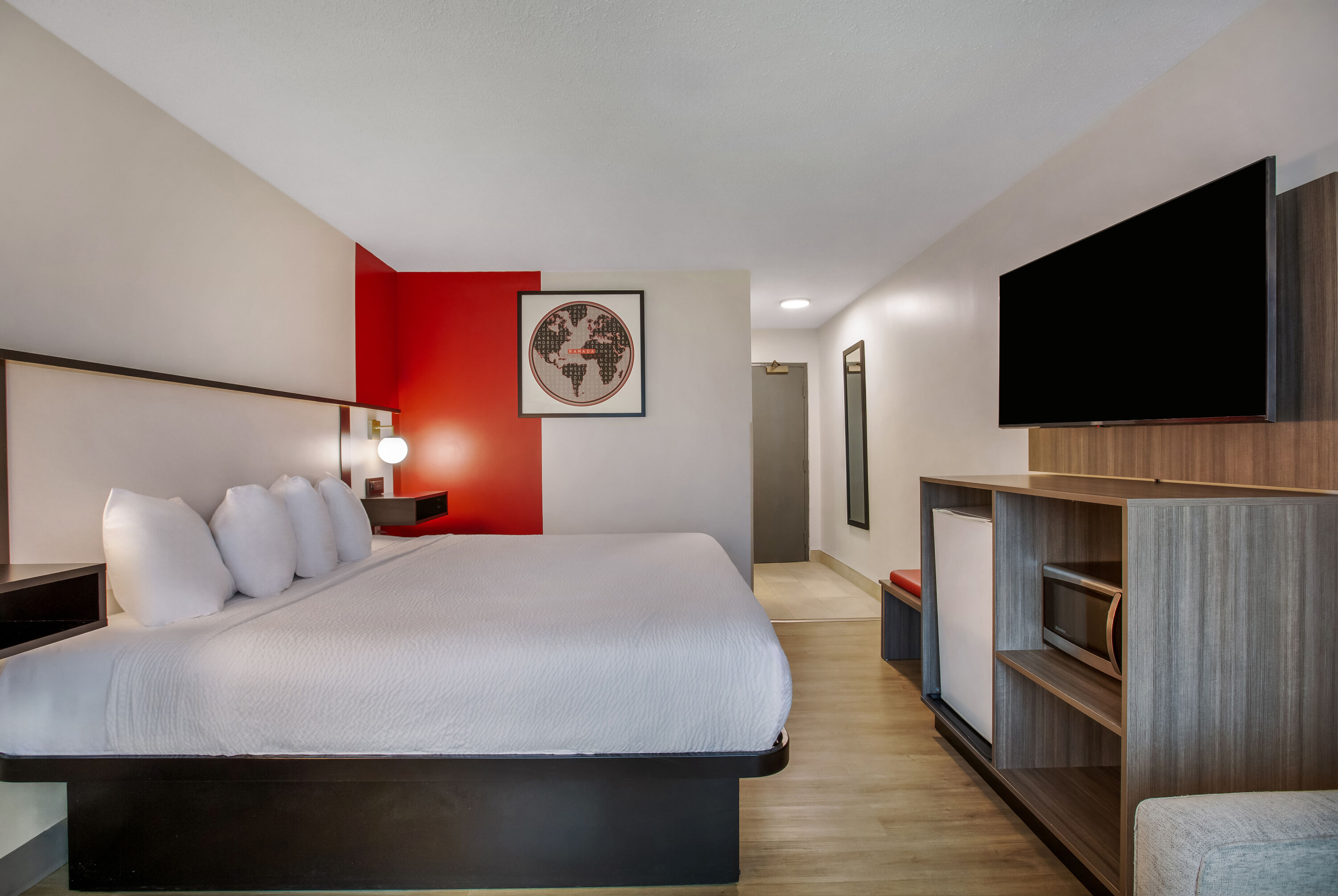 King bed guest room at the Ramada by Wyndham Kingston in Kingston, Ontario