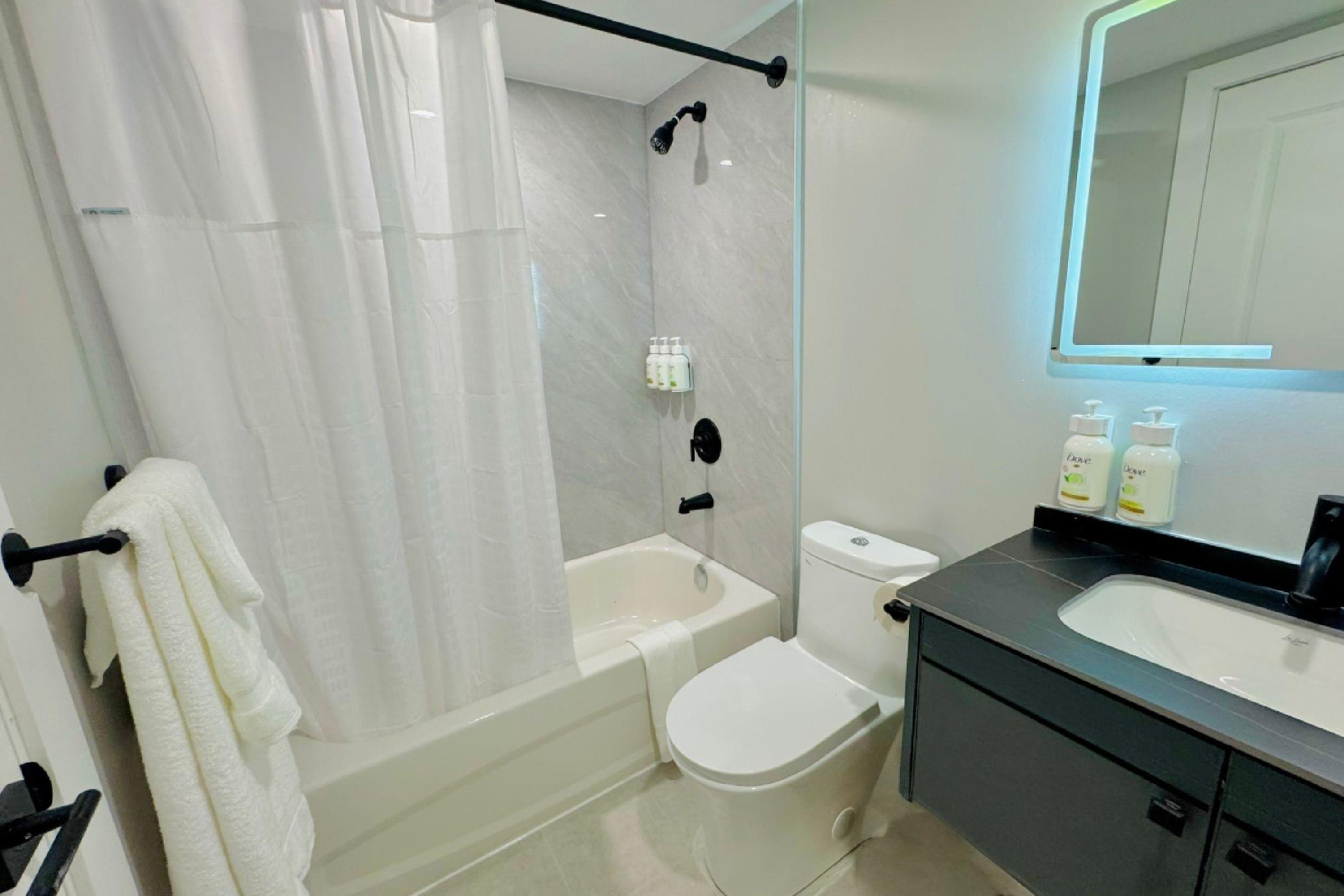 Guest room bath at the Ramada by Wyndham Kirkland Lake in Kirkland Lake, Ontario