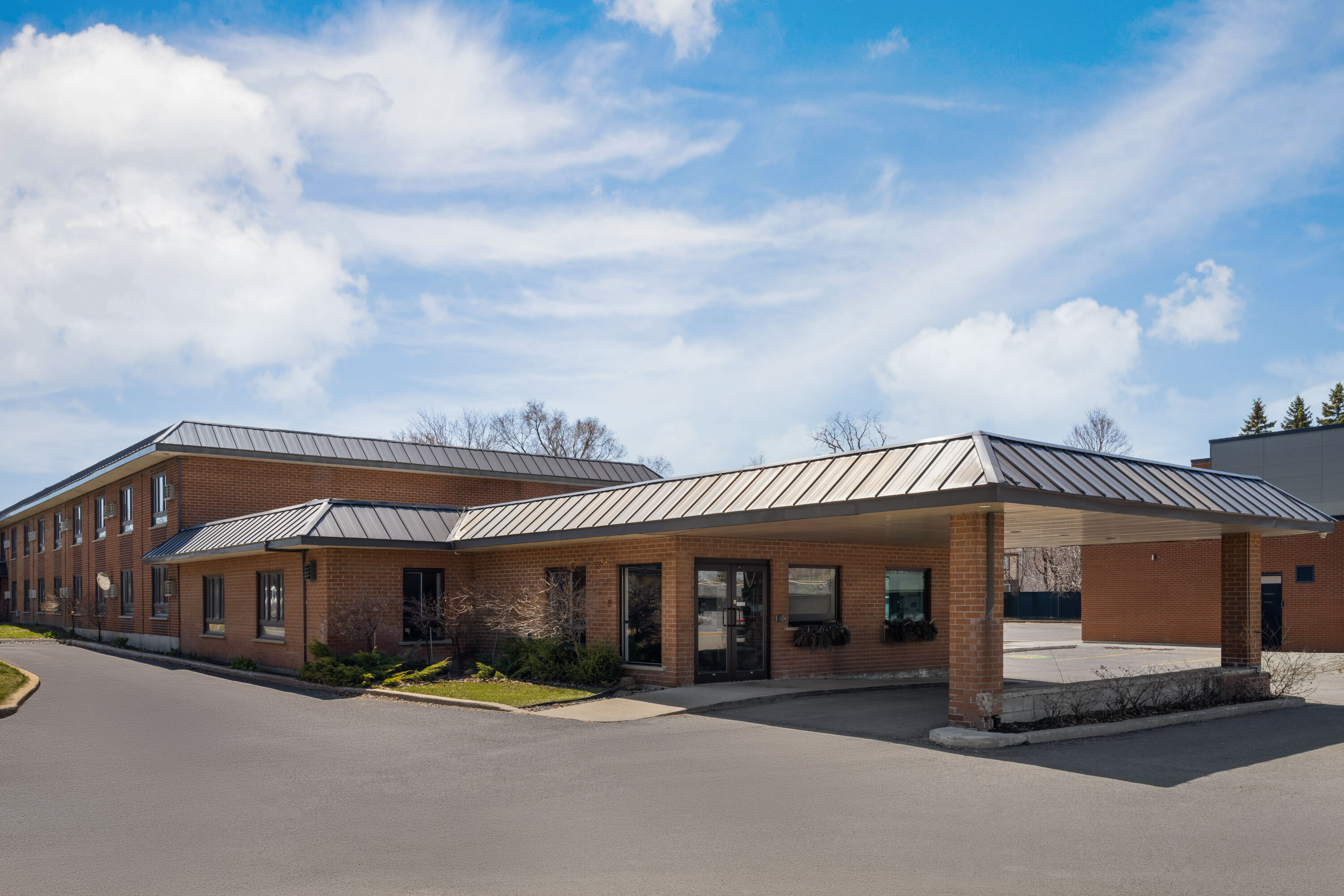 Exterior Day Image of Ramada by Wyndham Laval hotel in Laval, Quebec