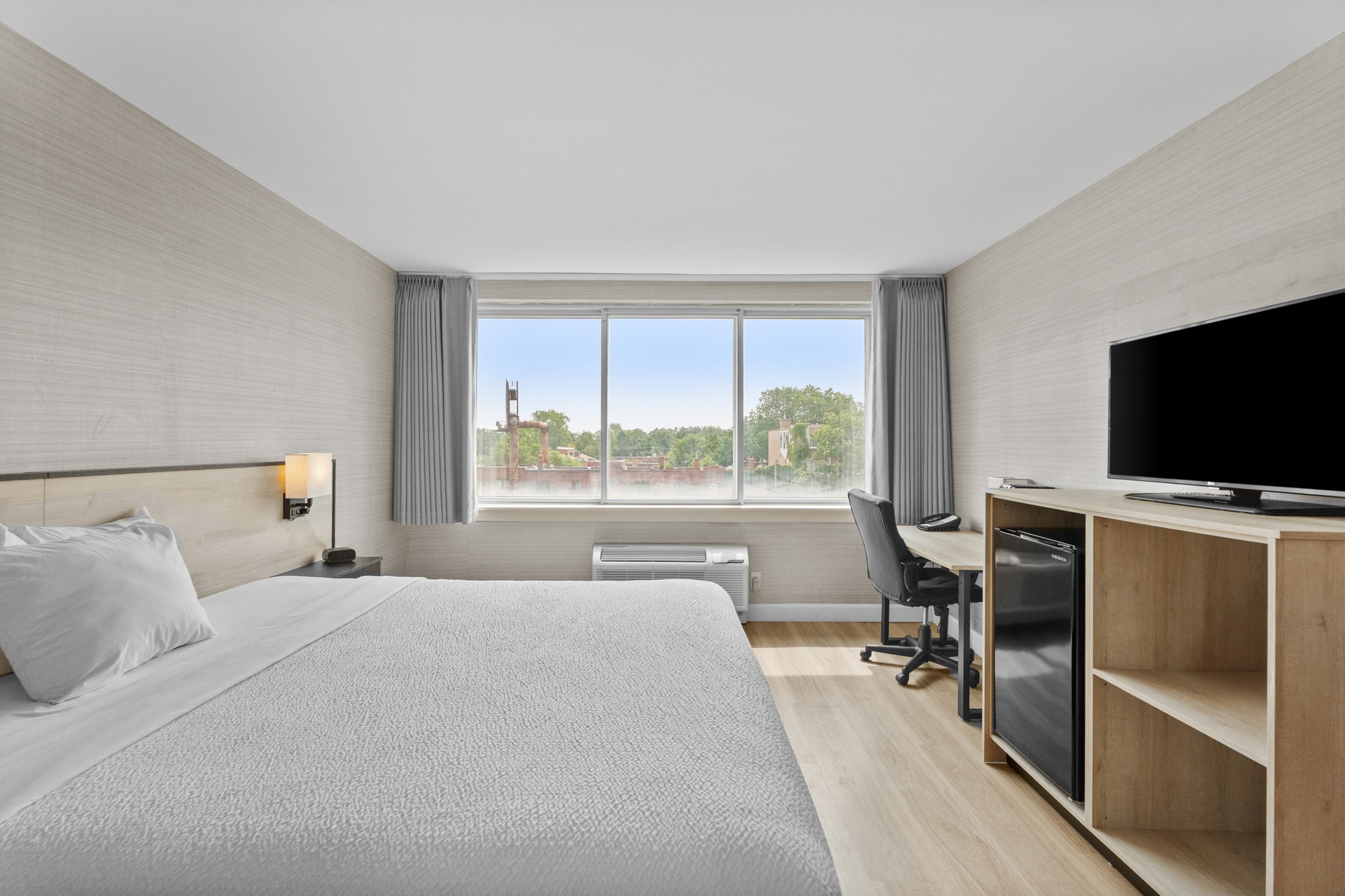 Guest room at the Ramada Plaza by Wyndham Montreal in Montreal, Quebec