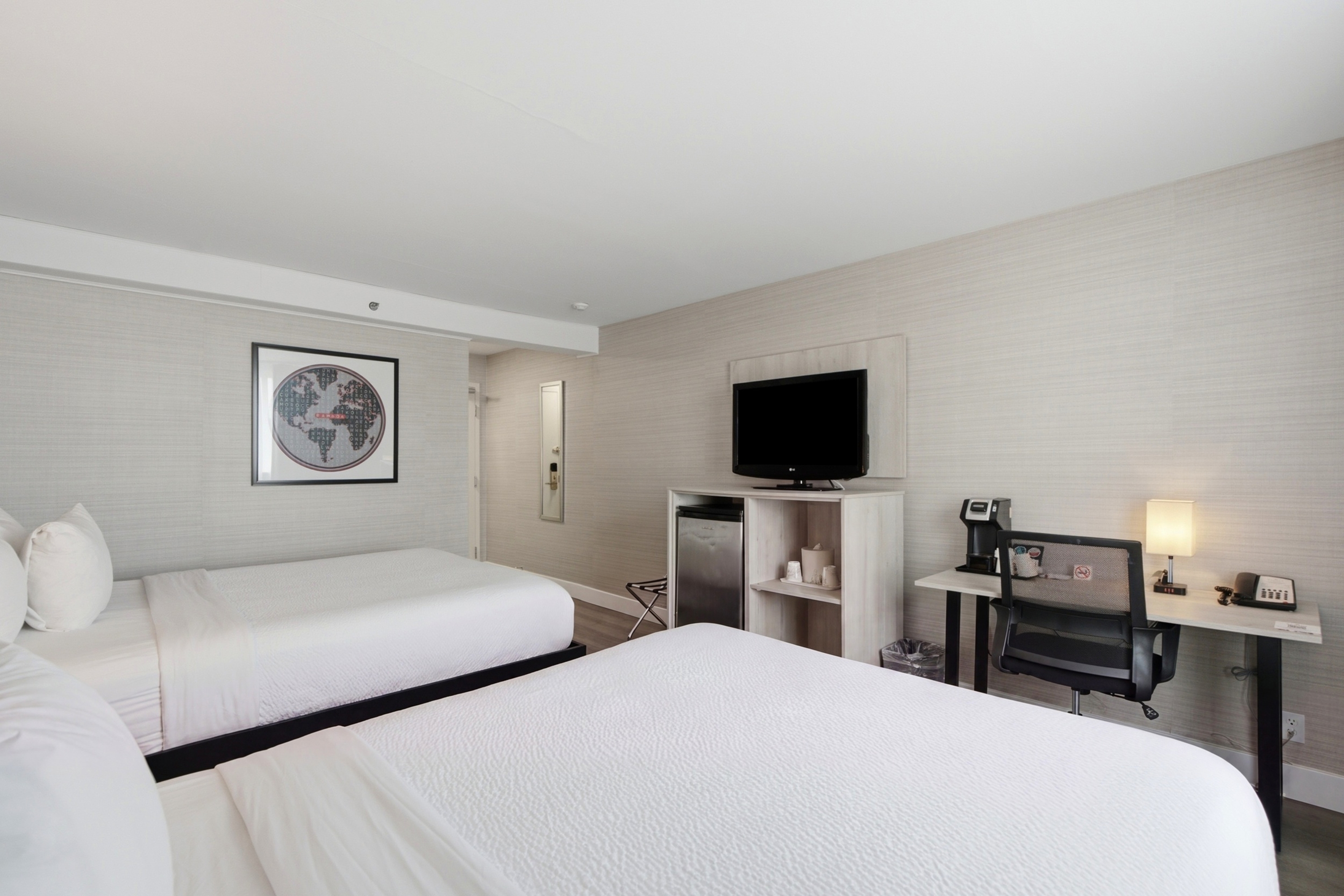 Guest room at the Ramada Plaza by Wyndham Montreal in Montreal, Quebec