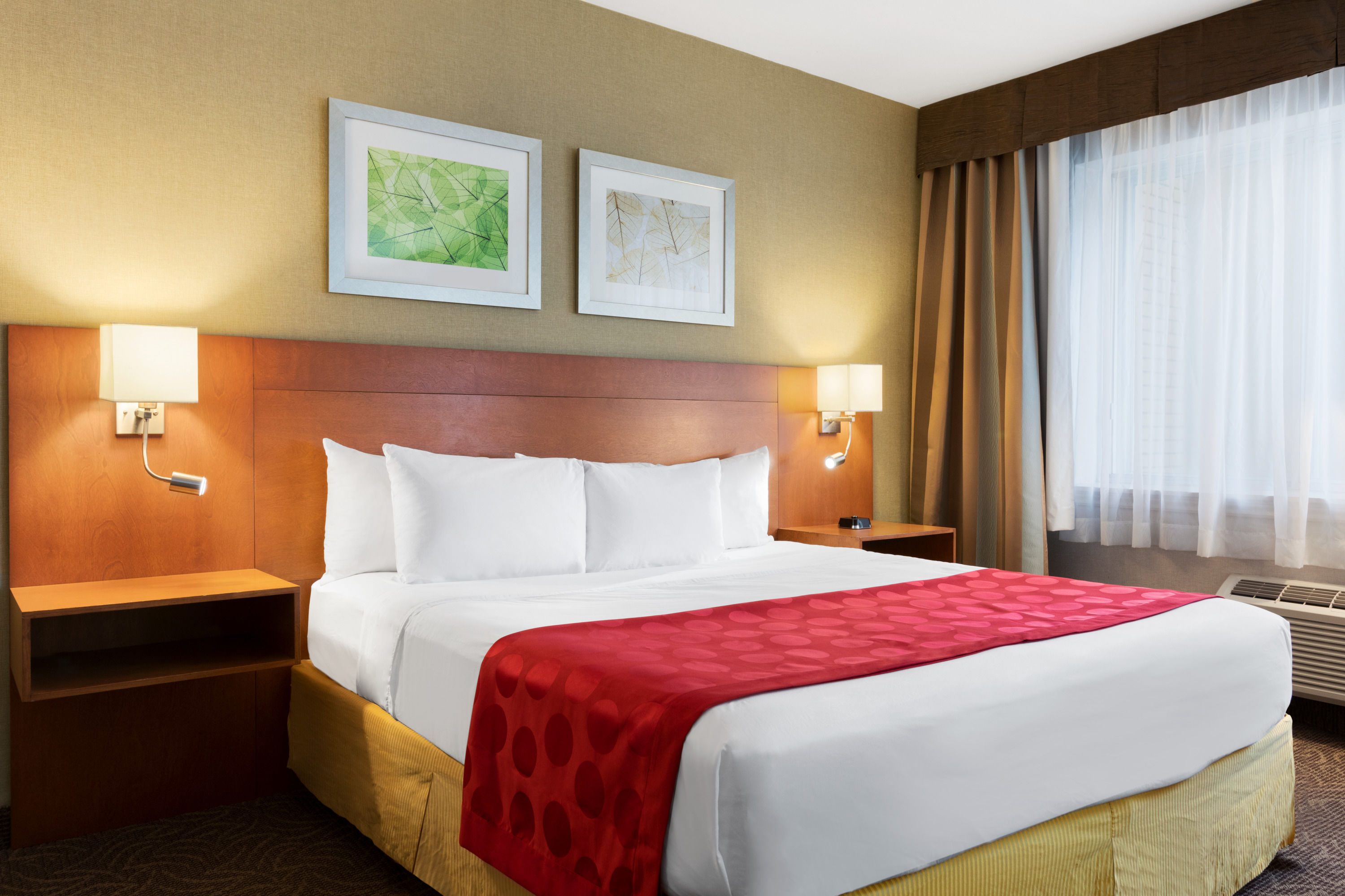 King bed guest room at the Ramada Plaza by Wyndham Montreal in Montreal, Quebec