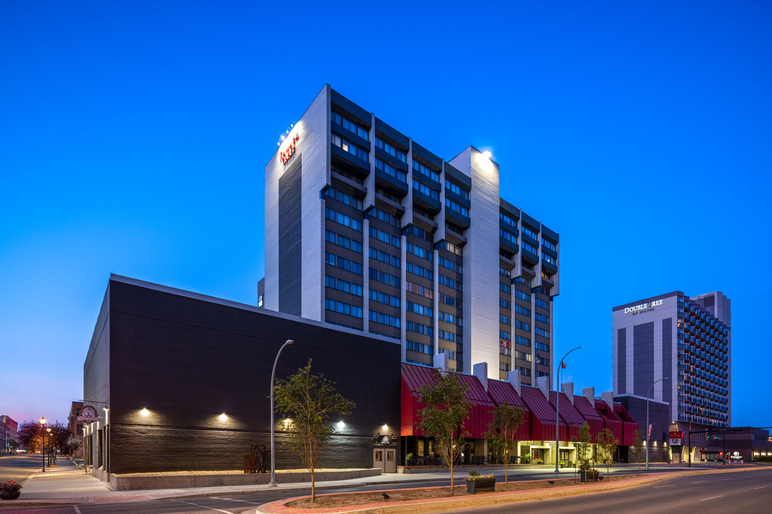 Exterior Dusk Image of Ramada Plaza by Wyndham Regina Downtown hotel in Regina, Saskatchewan