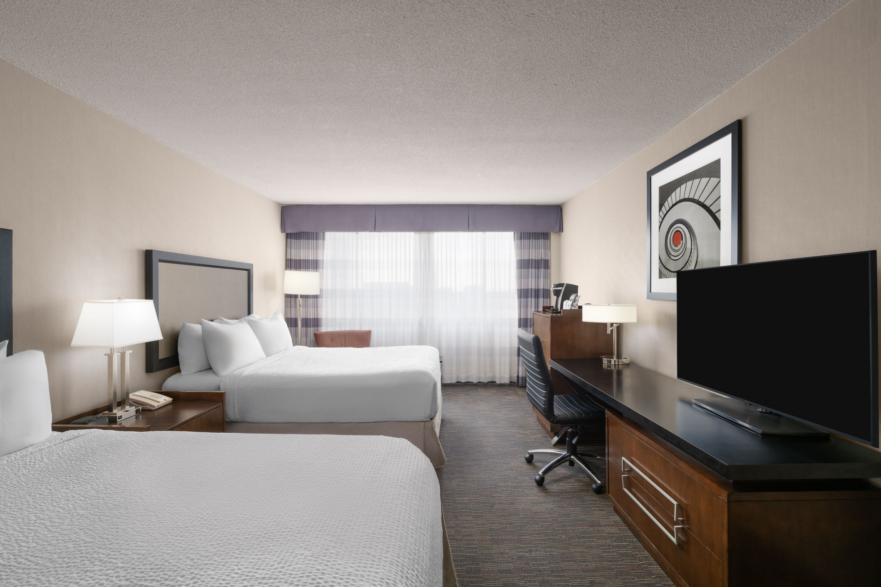 Guest room at the Ramada Plaza by Wyndham Regina Downtown in Regina, Saskatchewan