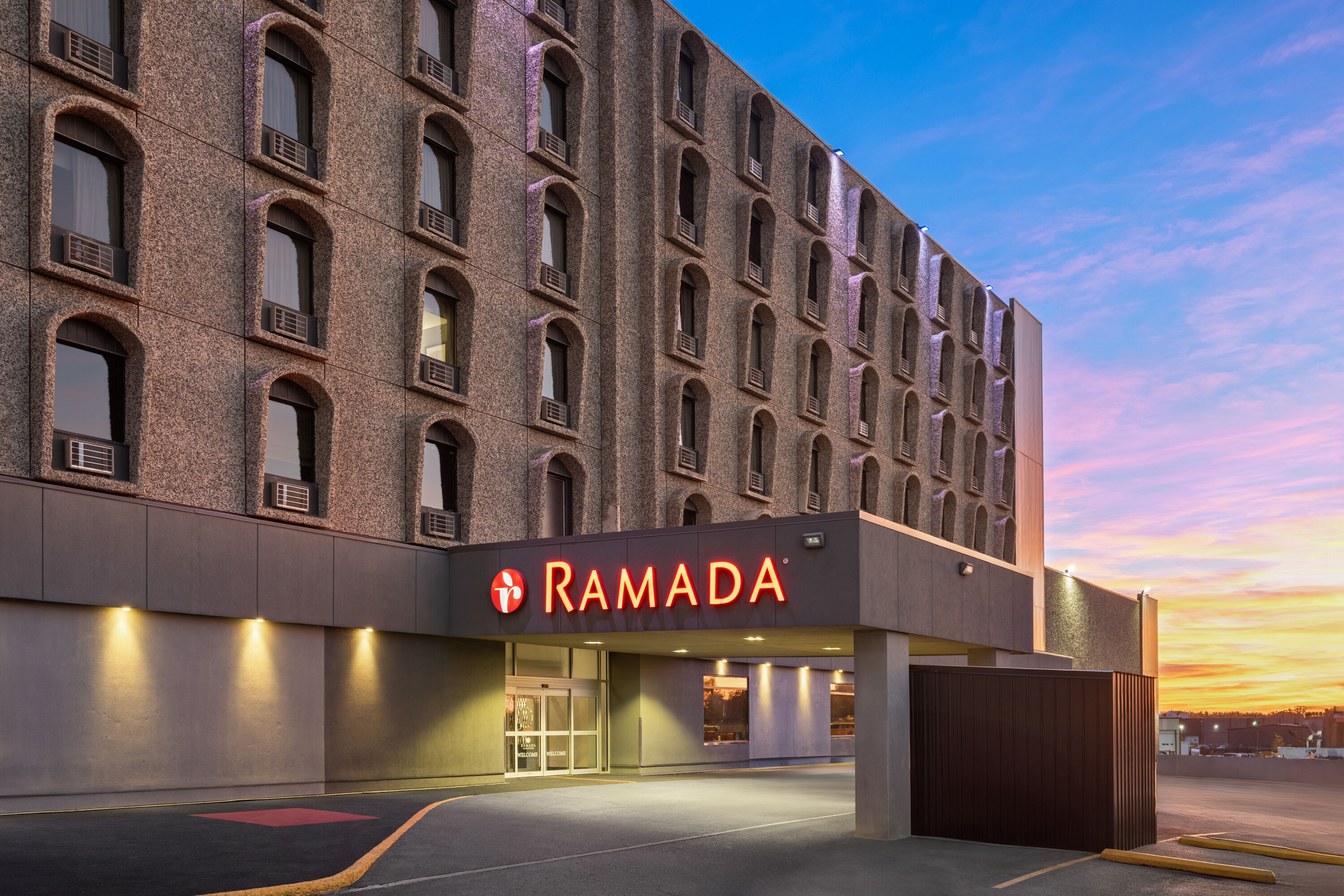 Exterior Dusk Image of Ramada by Wyndham Saskatoon hotel in Saskatoon, Saskatchewan