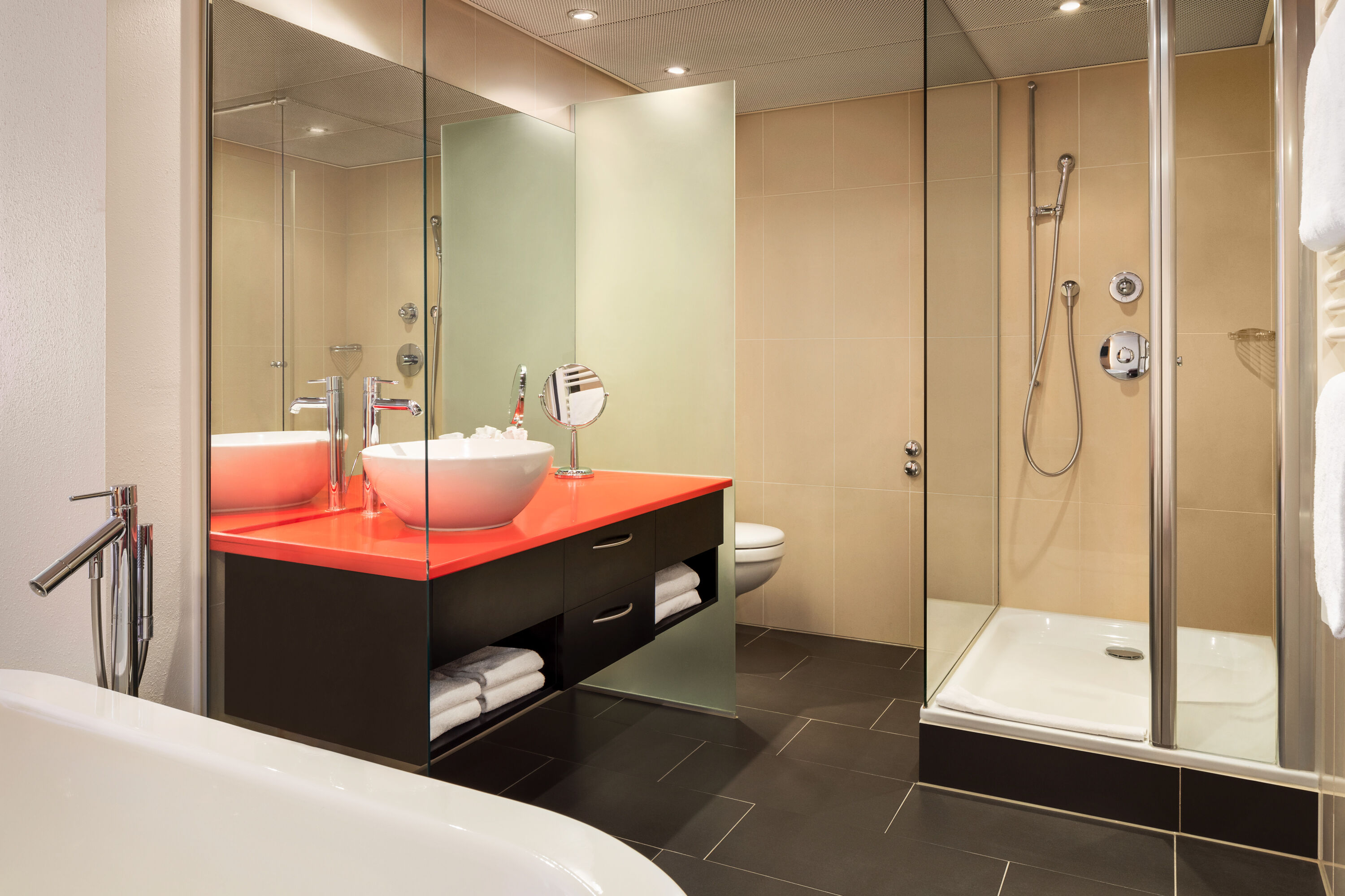 Guest room bath at the Ramada by Wyndham Baden du Parc in Baden, Other than US/Canada