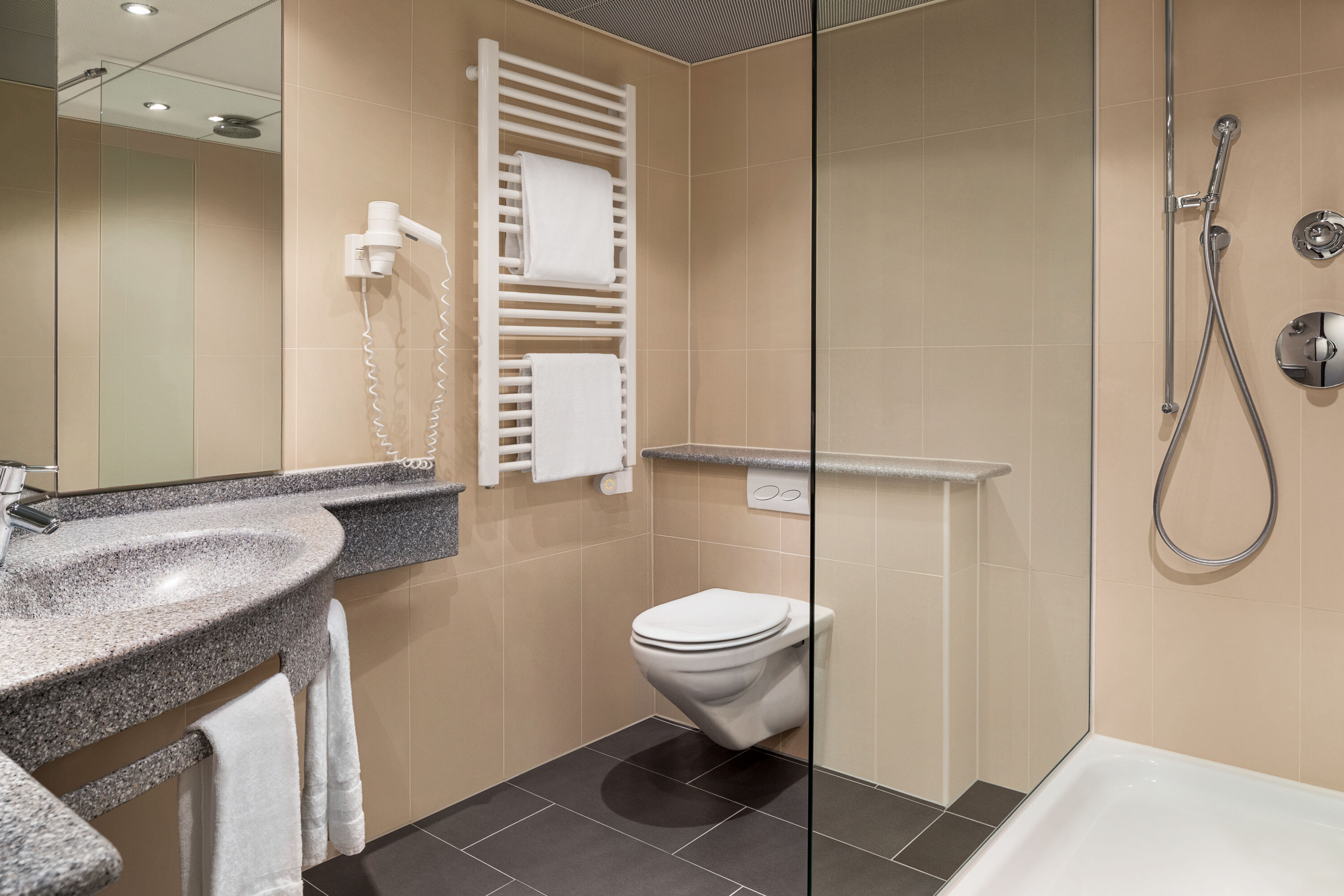 Guest room bath at the Ramada by Wyndham Baden du Parc in Baden, Other than US/Canada