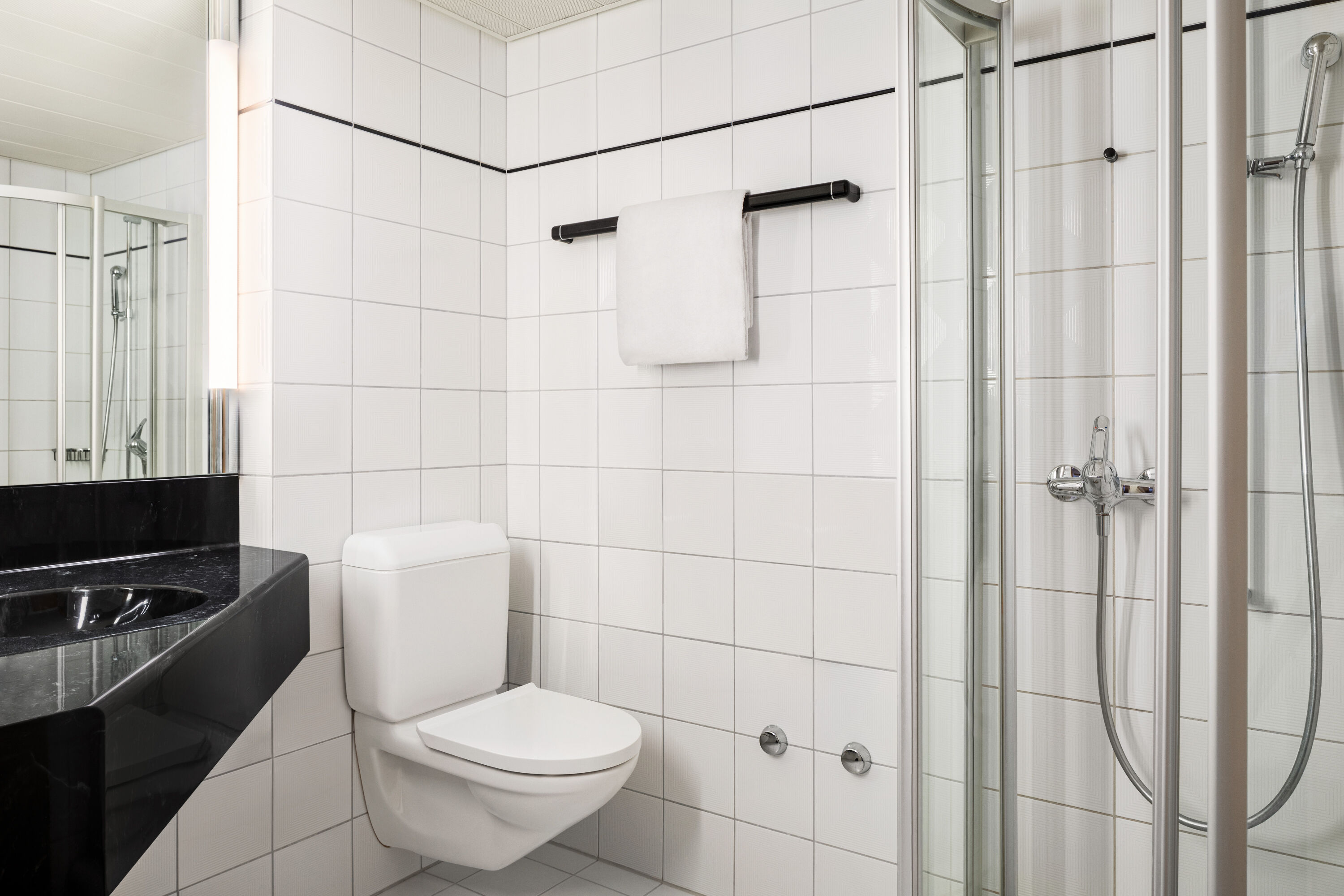 Guest room bath at the Ramada by Wyndham Baden du Parc in Baden, Other than US/Canada