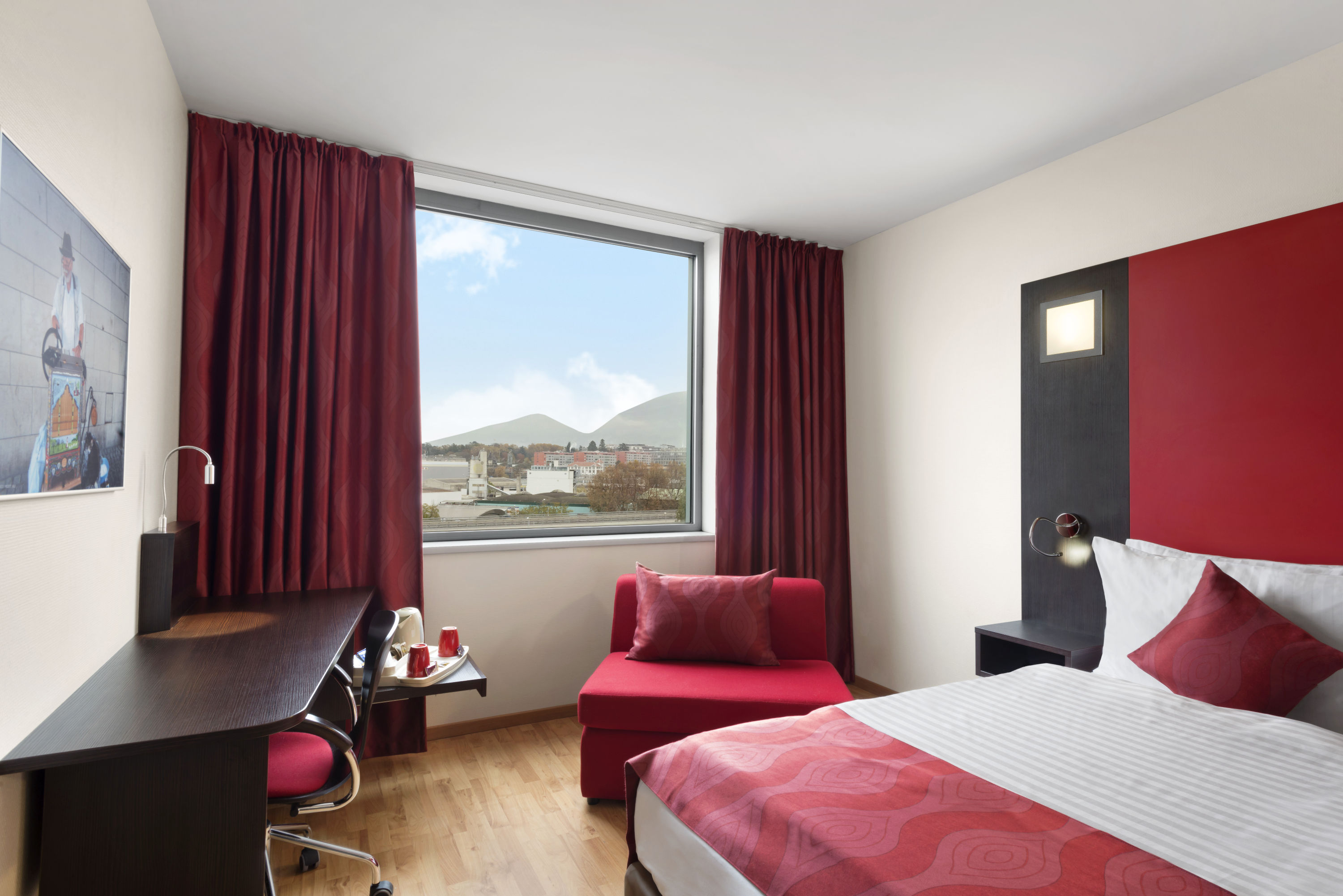 Guest room at the Ramada Encore by Wyndham Geneva in Geneve, Other than US/Canada