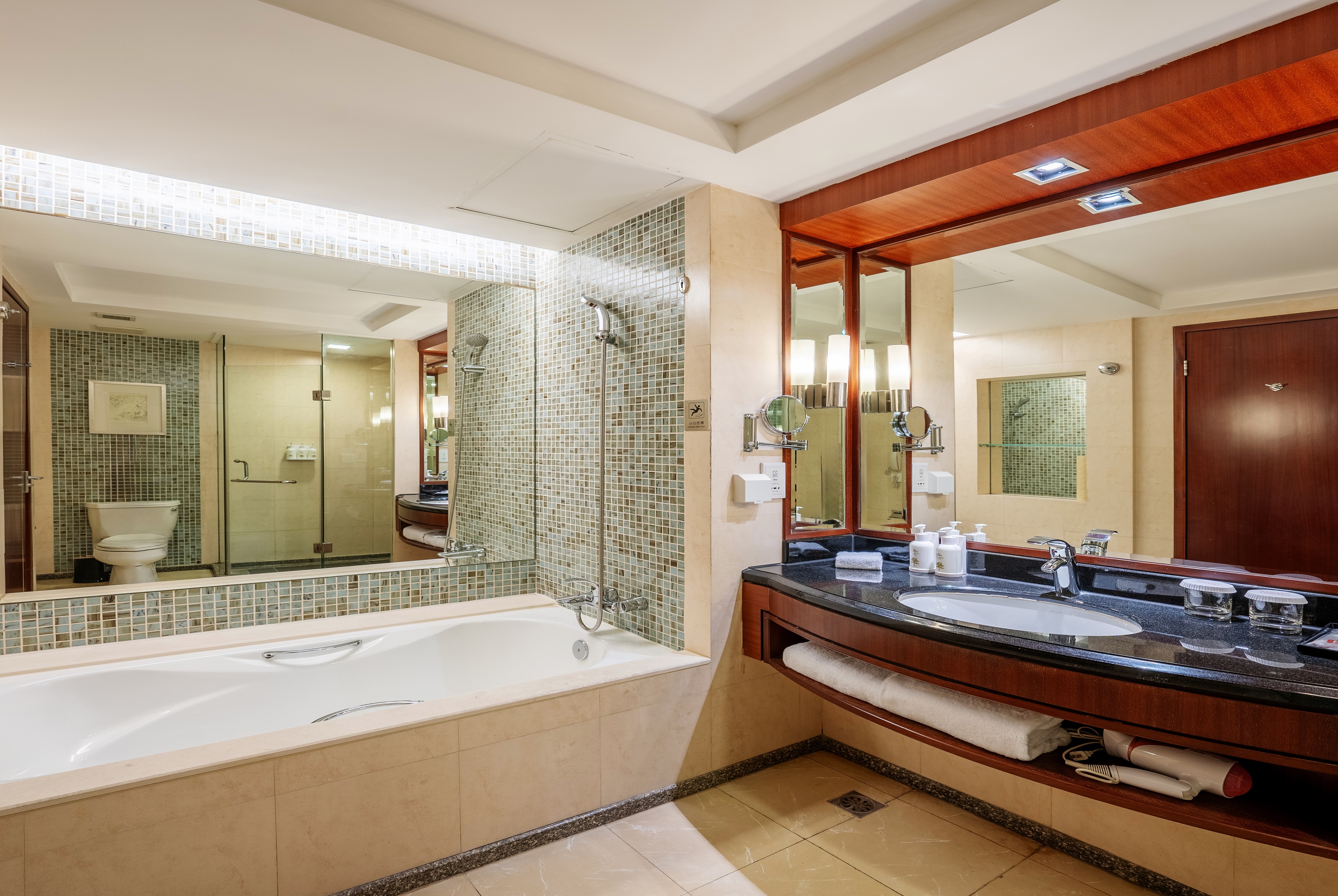 Guest room bath at the Ramada by Wyndham Beijing North in Beijing, Other than US/Canada