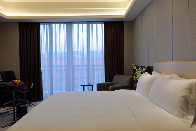 Guest room at the Ramada by Wyndham Huizhou South in Huizhou, Other than US/Canada