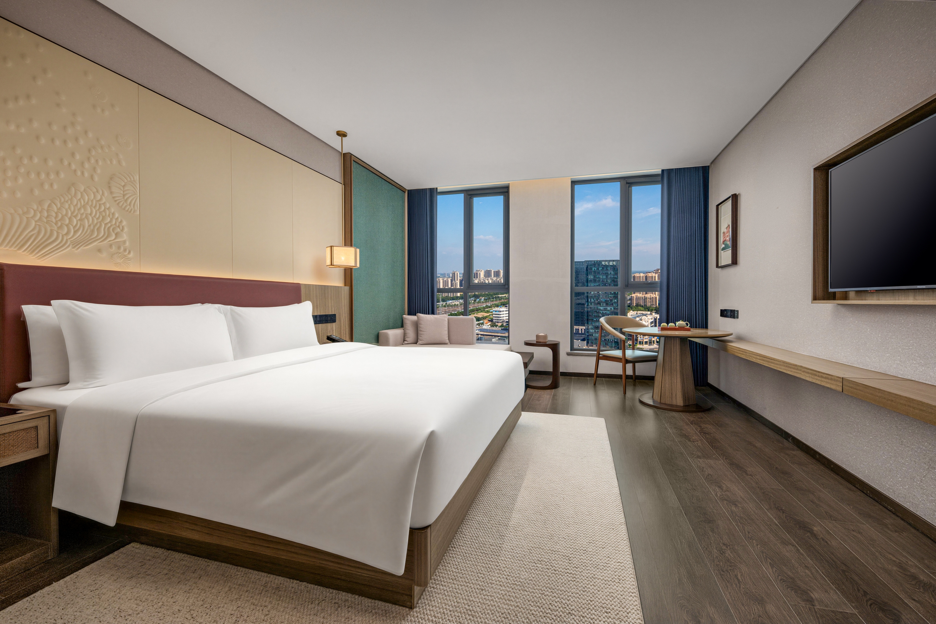 Guest room at the Ramada Plaza by Wyndham Jinan West Railway Station in Jinan, Other than US/Canada