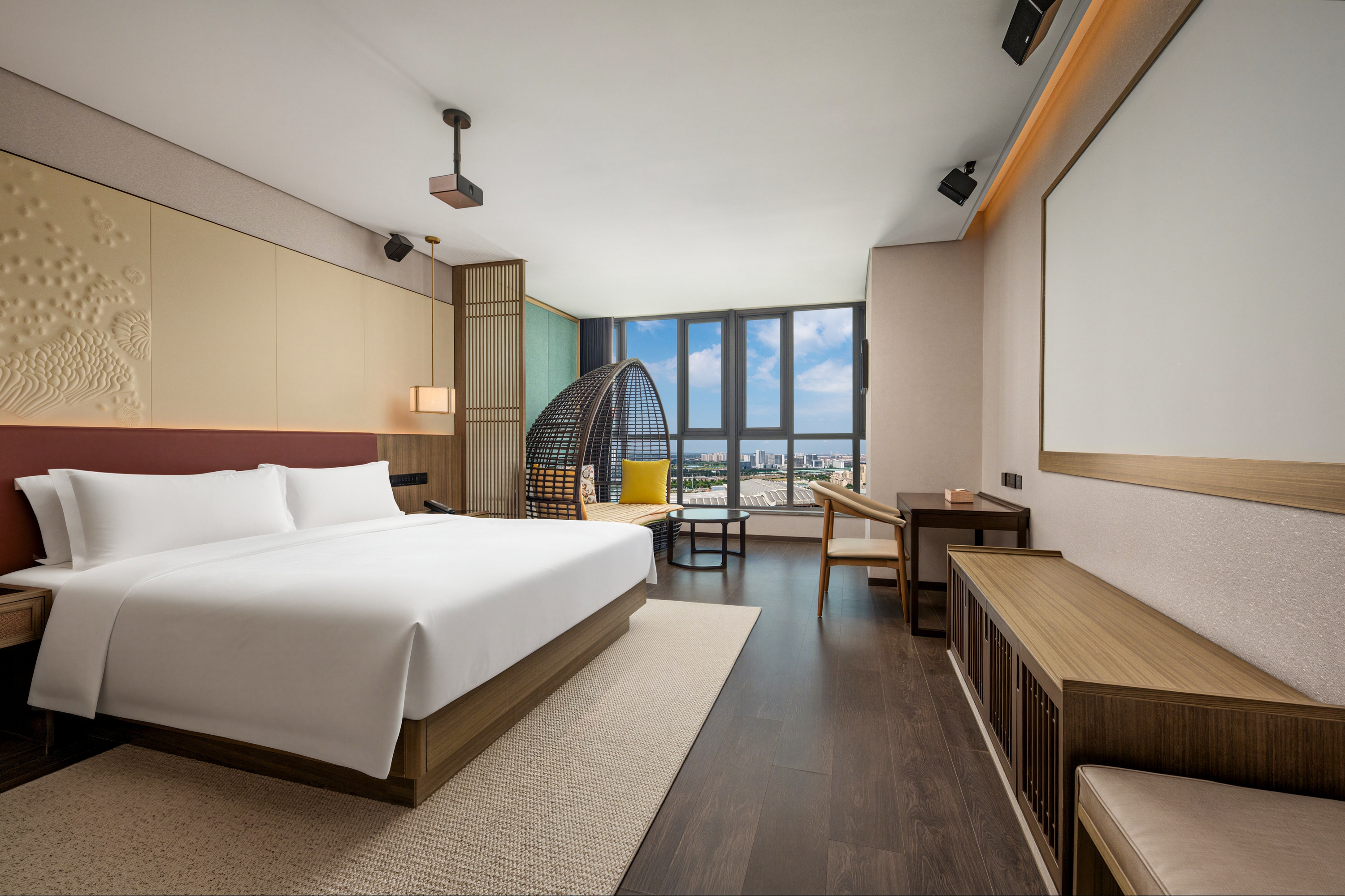 Guest room at the Ramada Plaza by Wyndham Jinan West Railway Station in Jinan, Other than US/Canada