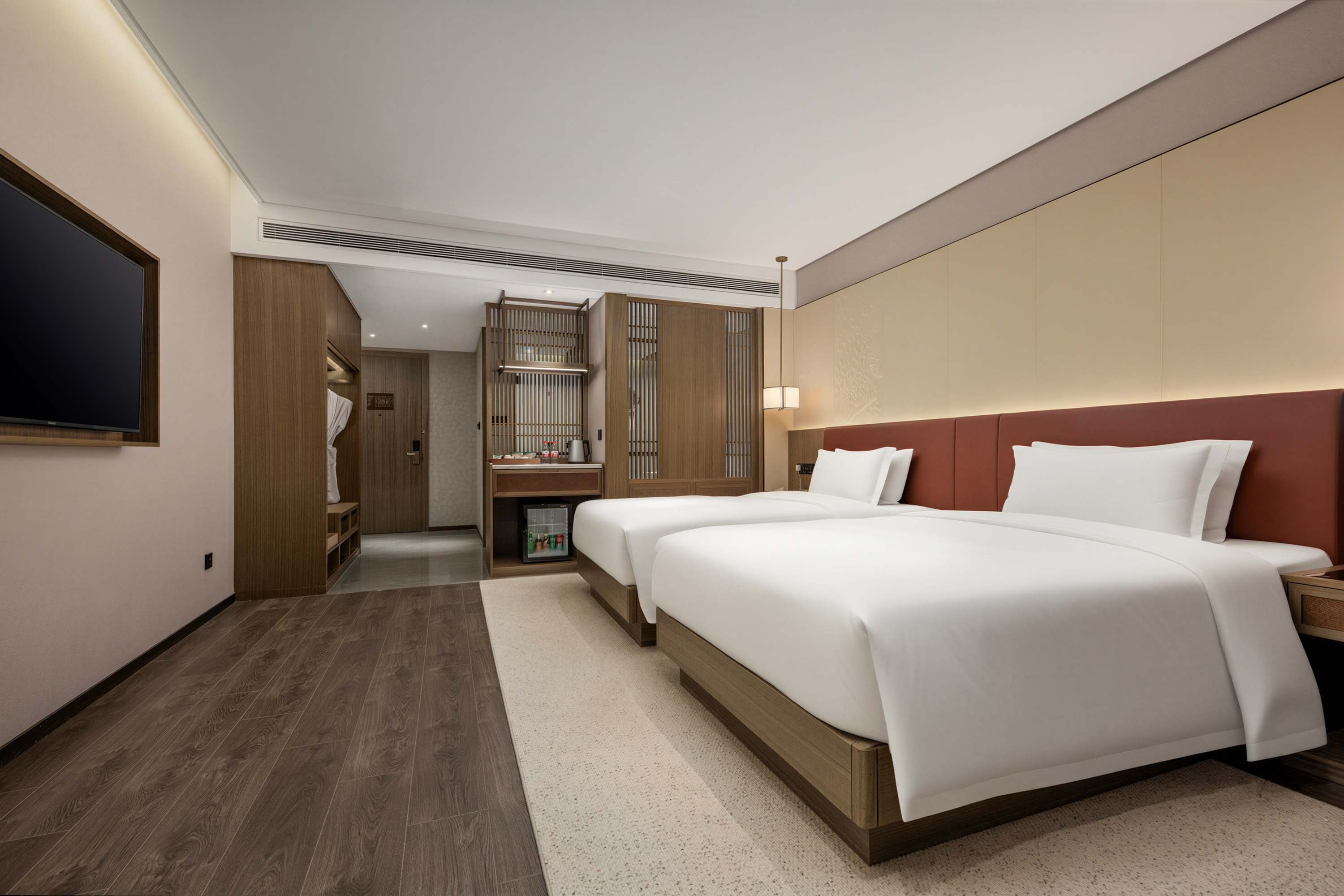 Guest room at the Ramada Plaza by Wyndham Jinan West Railway Station in Jinan, Other than US/Canada