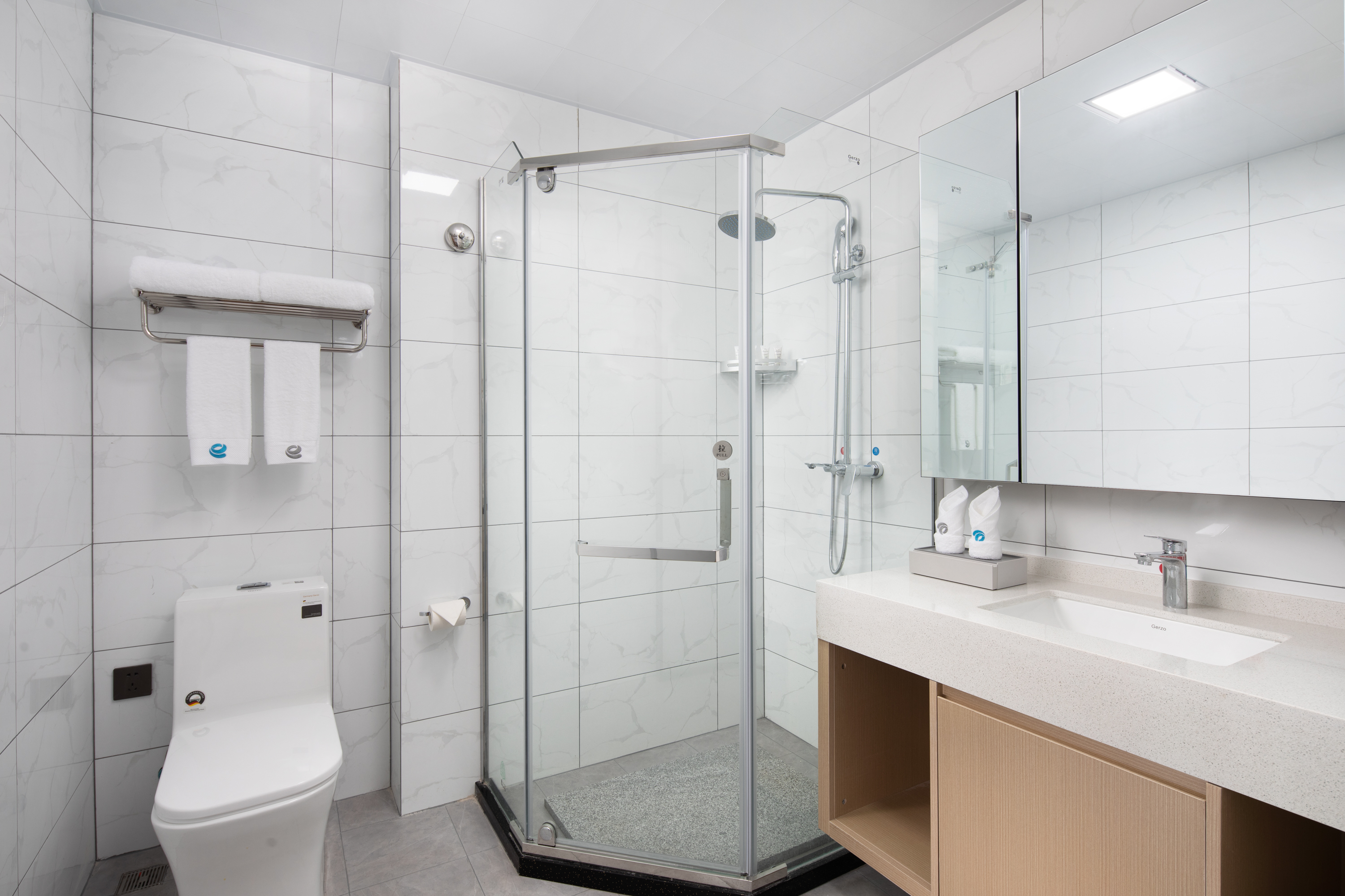 Guest room bath at the Ramada Encore by Wyndham Jiusuo Downtown in Ledong, Other than US/Canada