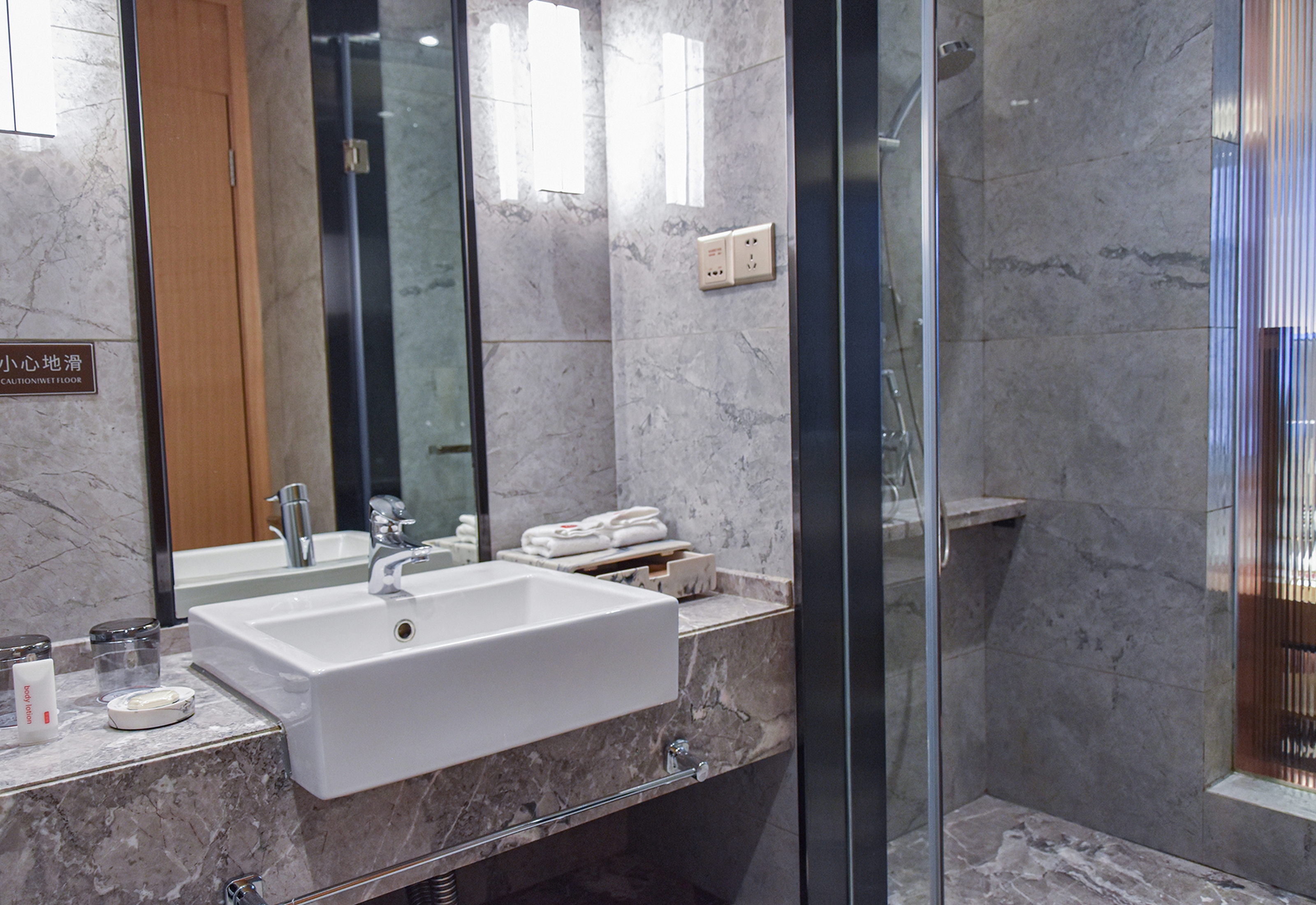 Guest room bath at the Ramada by Wyndham Leshan in Leshan, Other than US/Canada