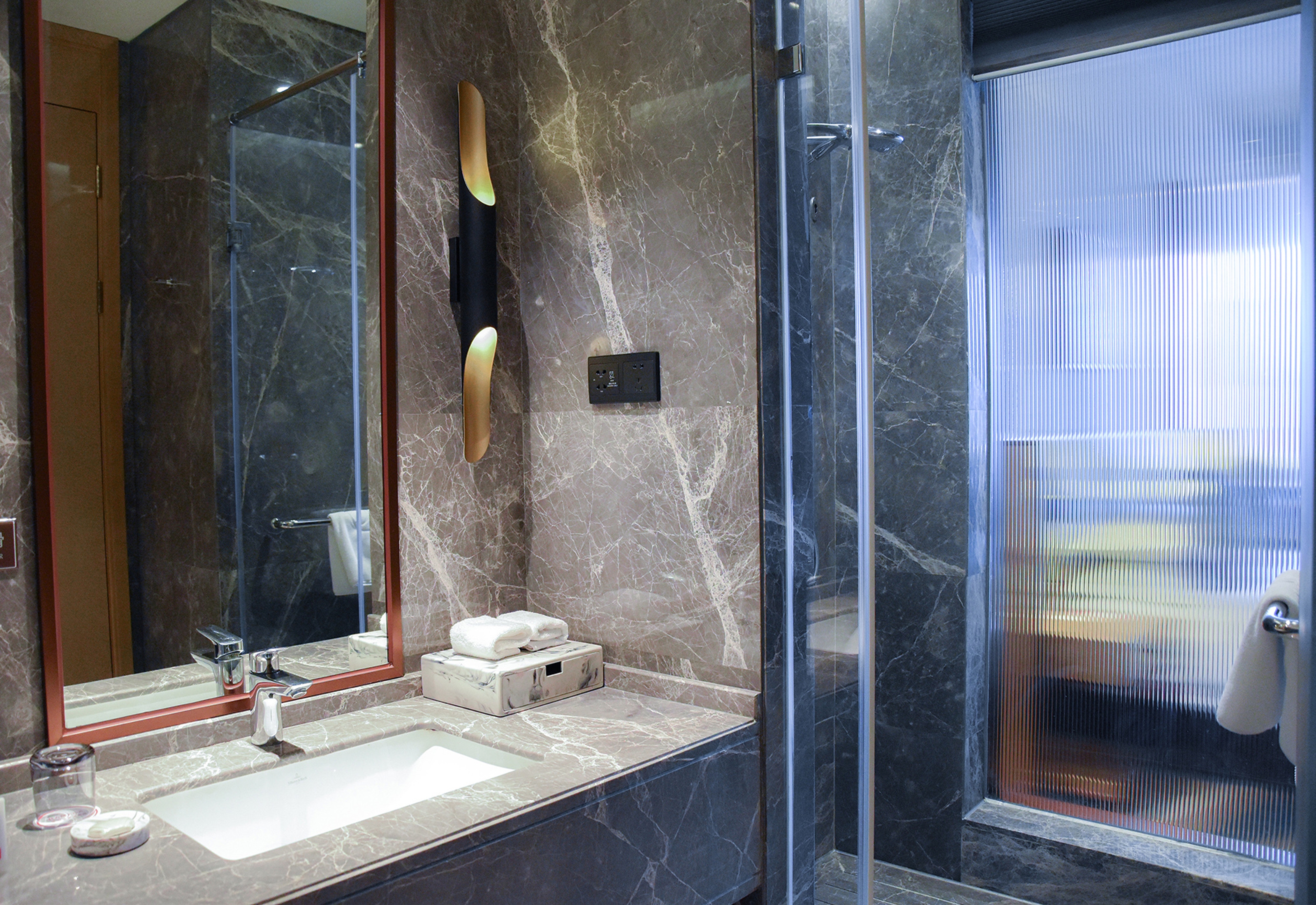 Guest room bath at the Ramada by Wyndham Leshan in Leshan, Other than US/Canada