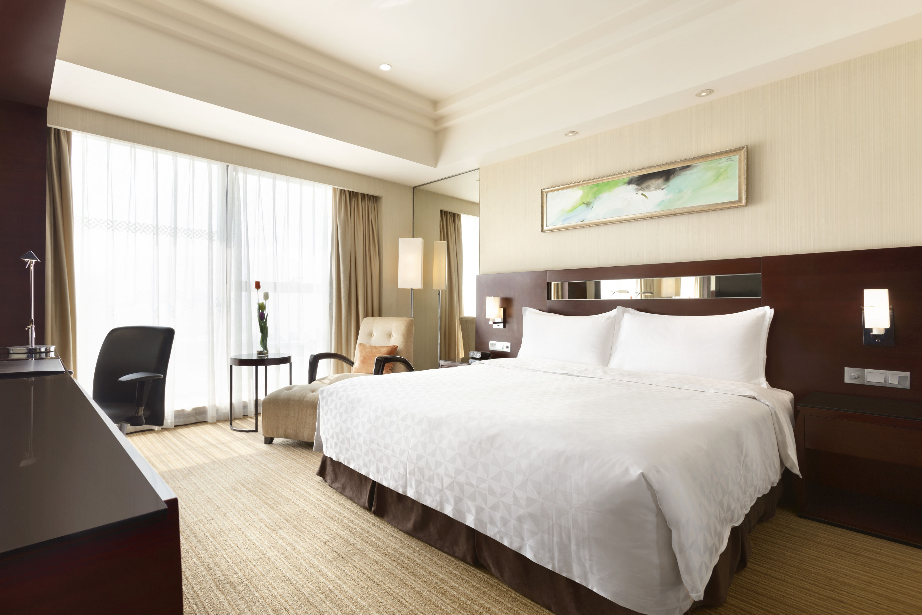 Guest room at the Ramada Plaza by Wyndham Lianyungang in Lianyungang, Other than US/Canada