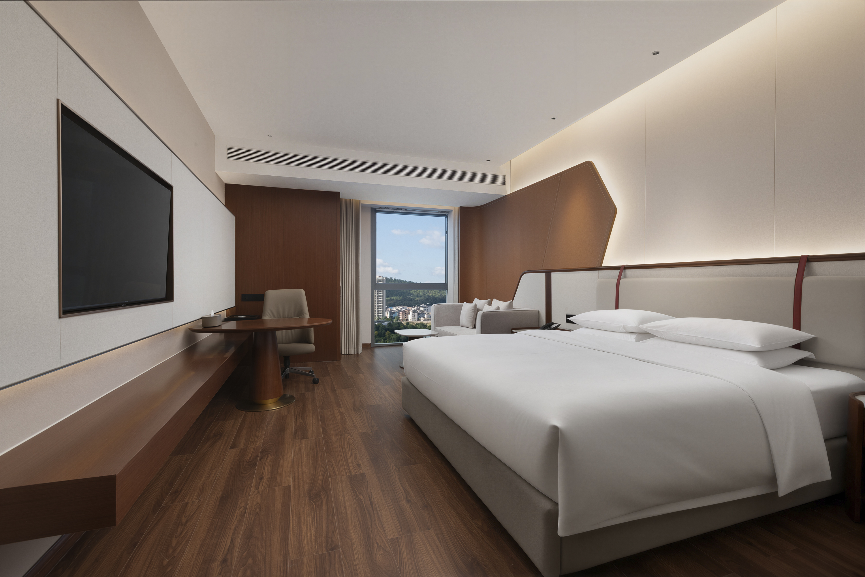 Guest room at the Ramada by Wyndham Luzhou Longmatan in Luzhou, Other than US/Canada