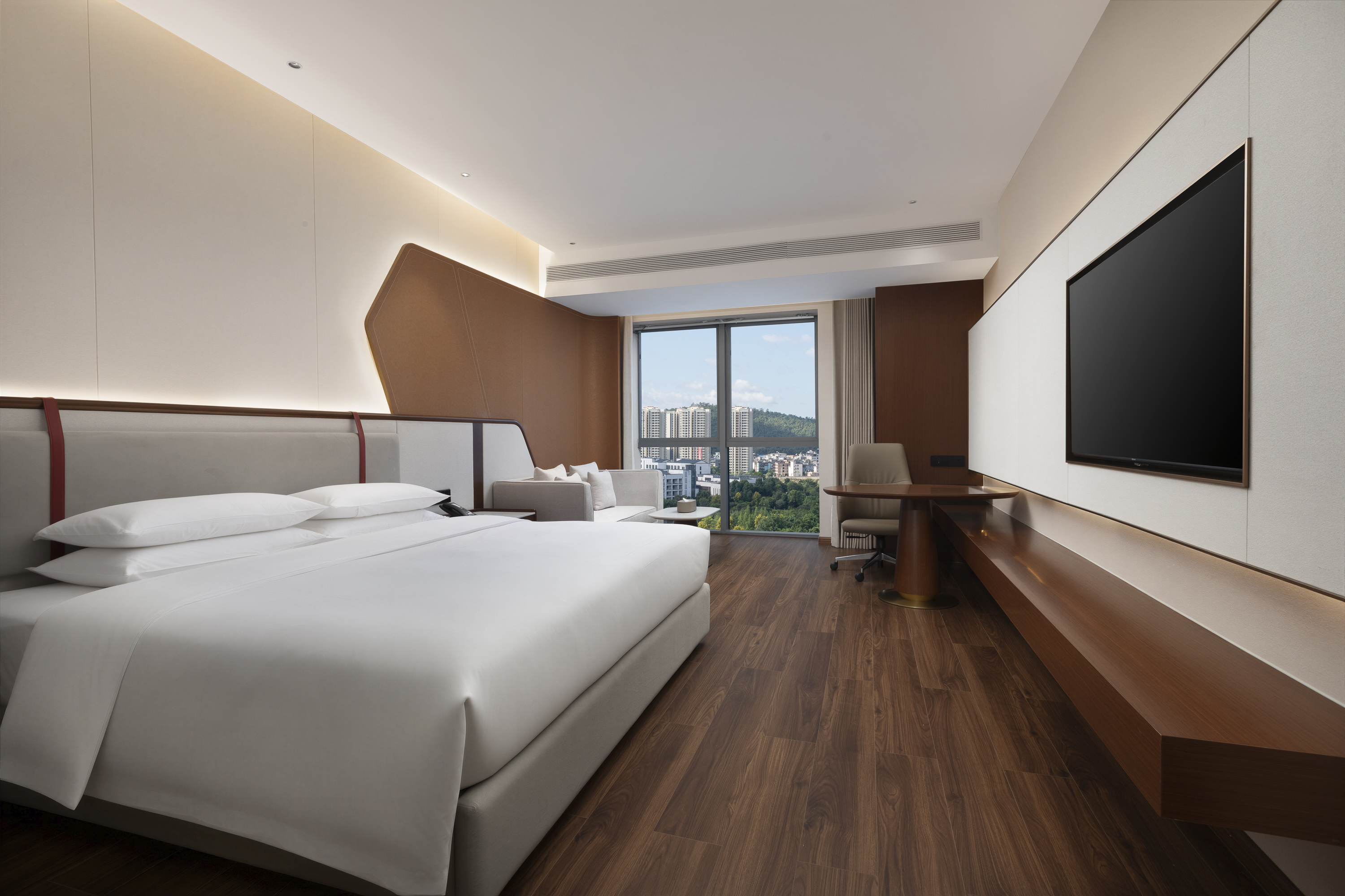 Guest room at the Ramada by Wyndham Luzhou Longmatan in Luzhou, Other than US/Canada