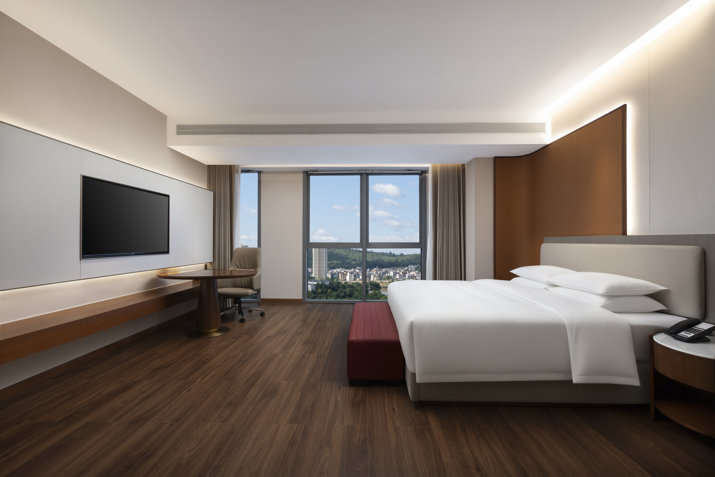 Guest room at the Ramada by Wyndham Luzhou Longmatan in Luzhou, Other than US/Canada