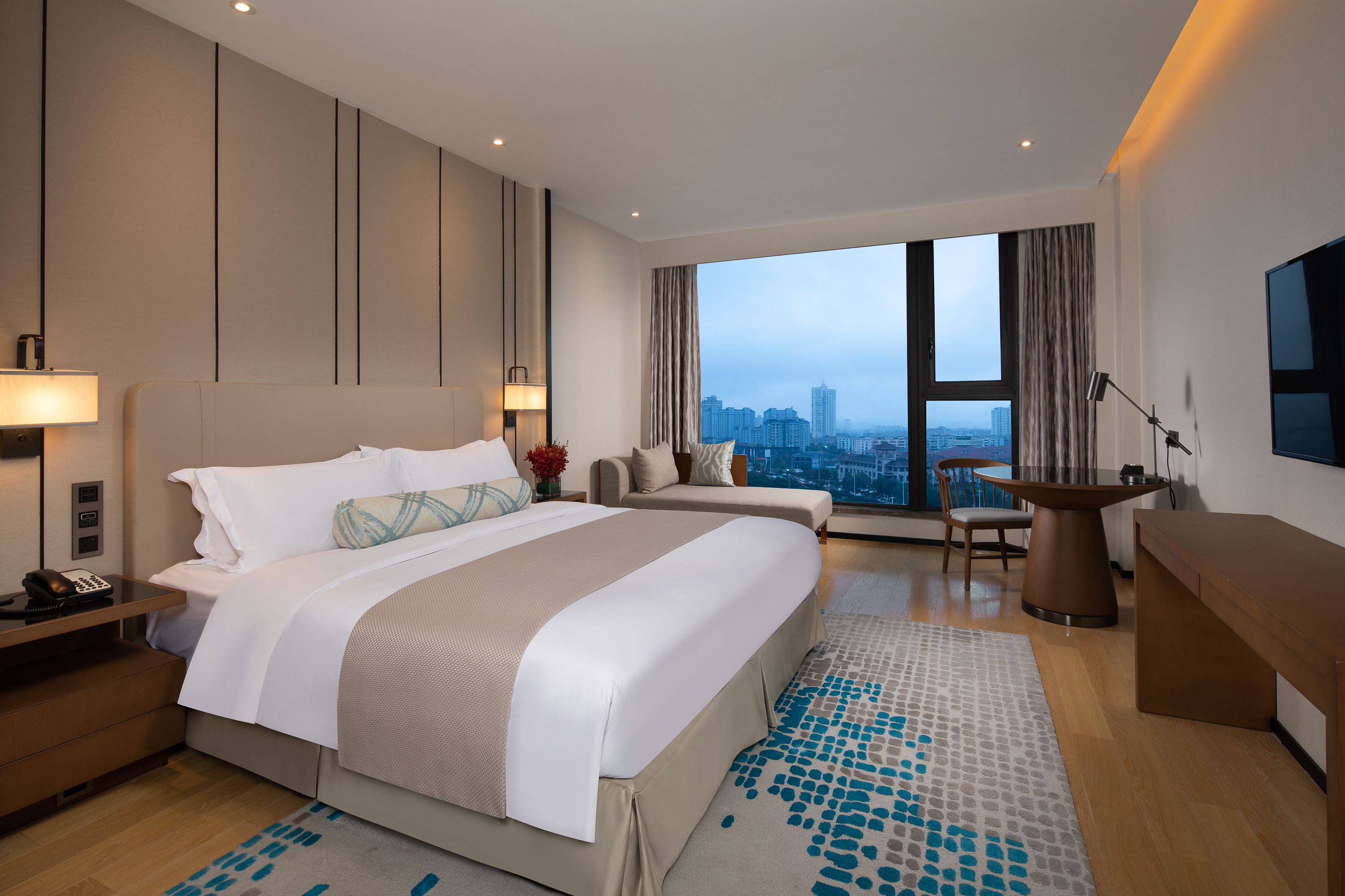 Guest room at the Ramada Plaza by Wyndham Wenzhou Cangnan in Wenzhou, Other than US/Canada
