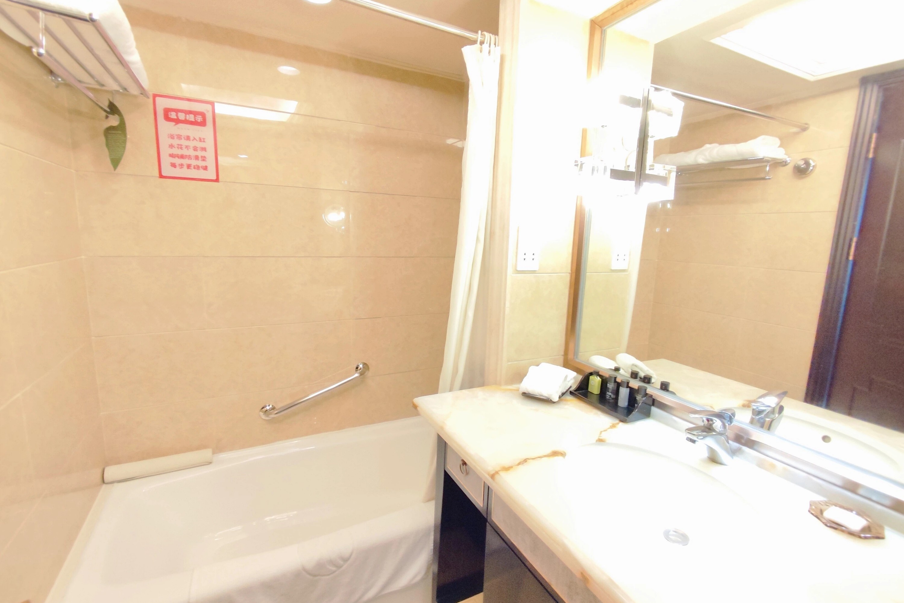 Guest room bath at the Ramada Plaza by Wyndham Tian Lu Hotel Wuhan in Wuhan, Other than US/Canada