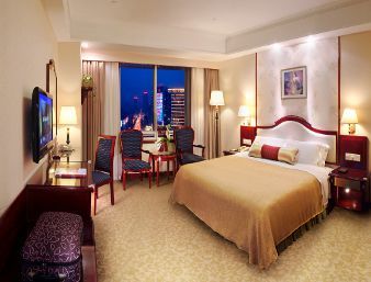 Guest room at the Ramada Plaza by Wyndham Tian Lu Hotel Wuhan in Wuhan, Other than US/Canada
